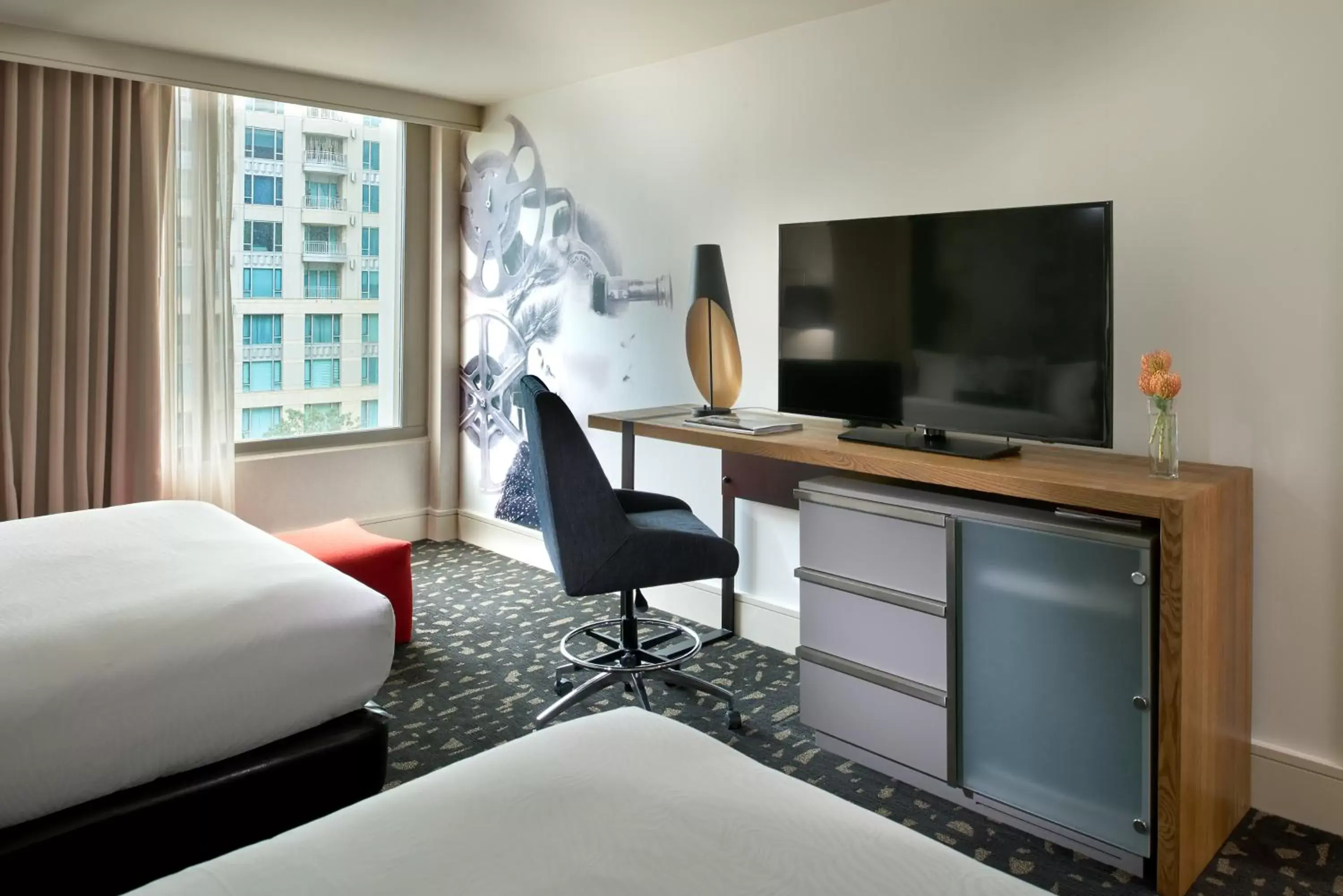 Bed, TV/Entertainment Center in Kimpton Hotel Palomar Los Angeles Beverly Hills, an IHG Hotel