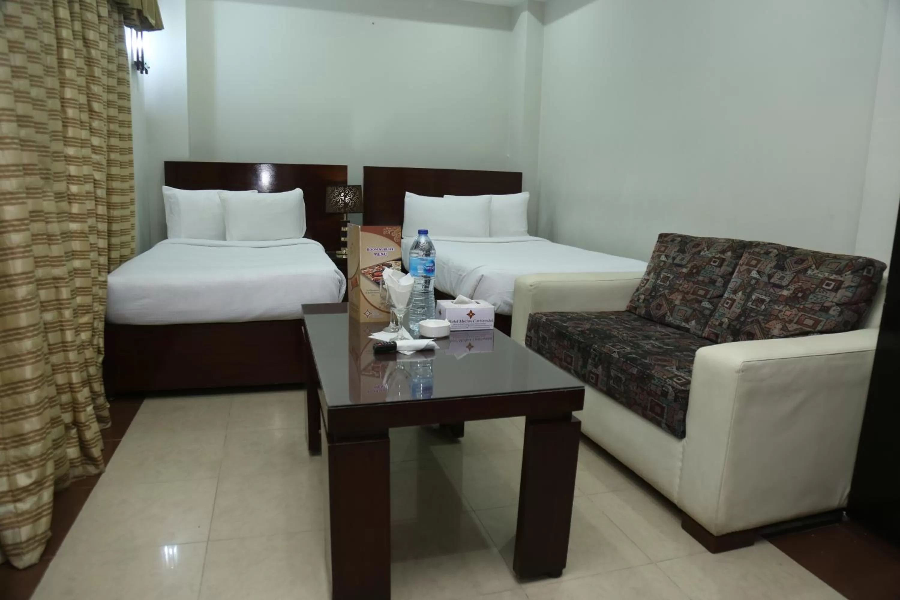 Bed in Hotel Multan Continental
