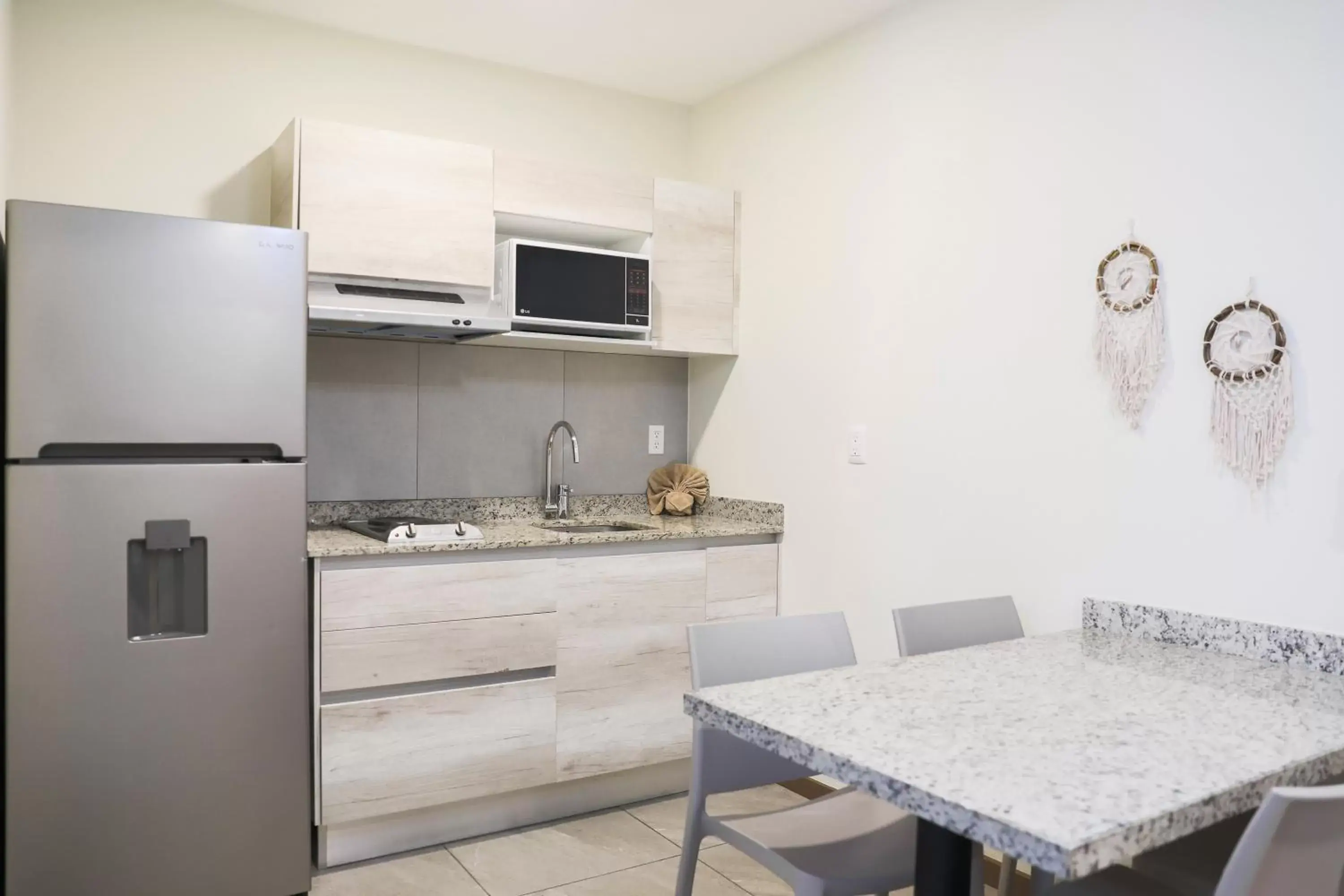 Kitchen/Kitchenette in Grand Fifty Suites