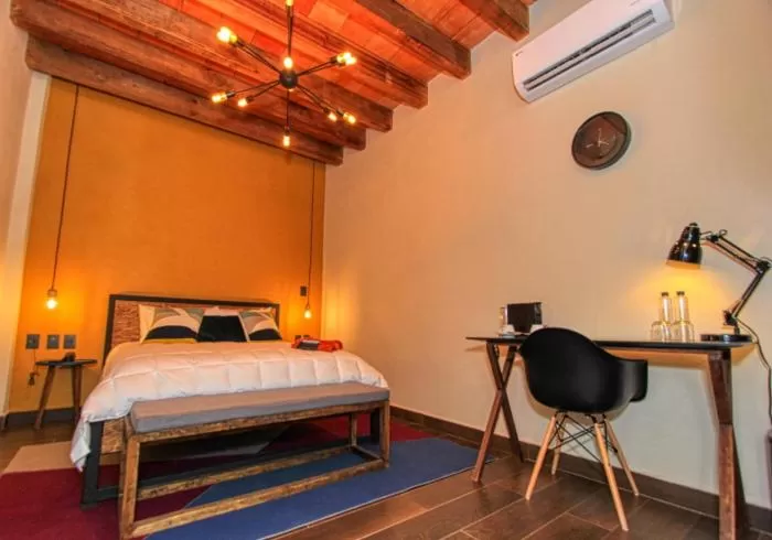 Bed in Antigua Trece Hotel Fusión