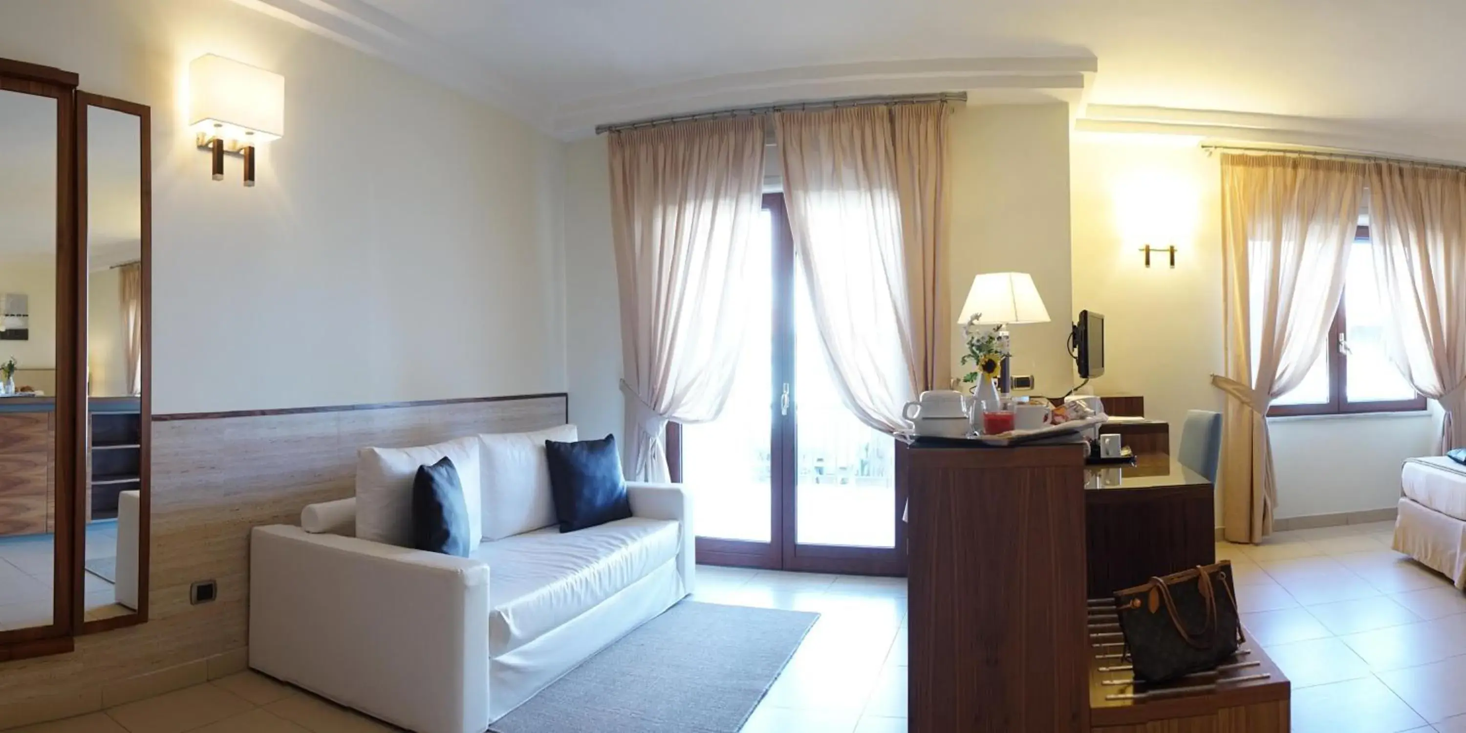 Photo of the whole room, Seating Area in Suites & Residence Hotel