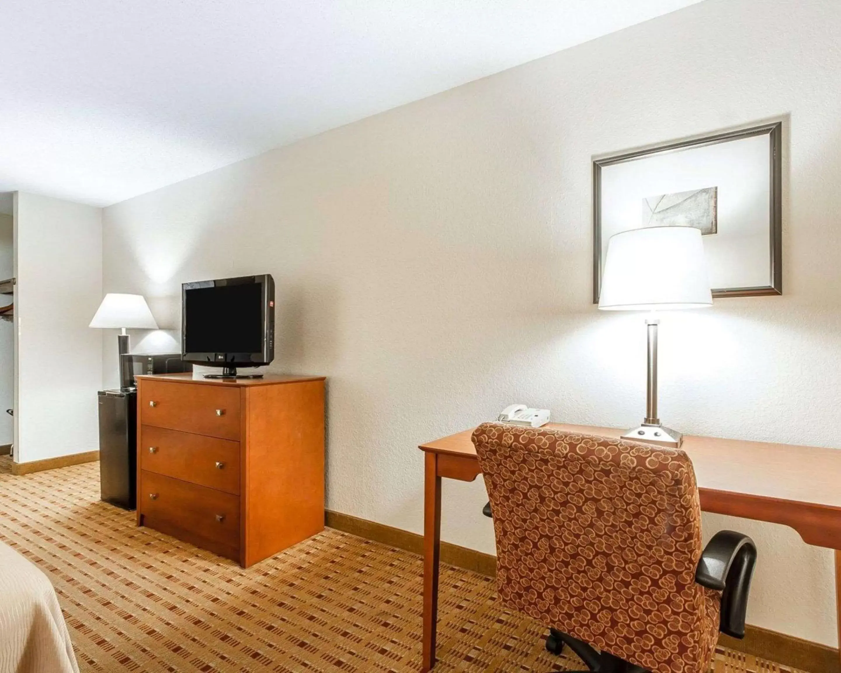 Photo of the whole room, TV/Entertainment Center in Quality Inn & Suites