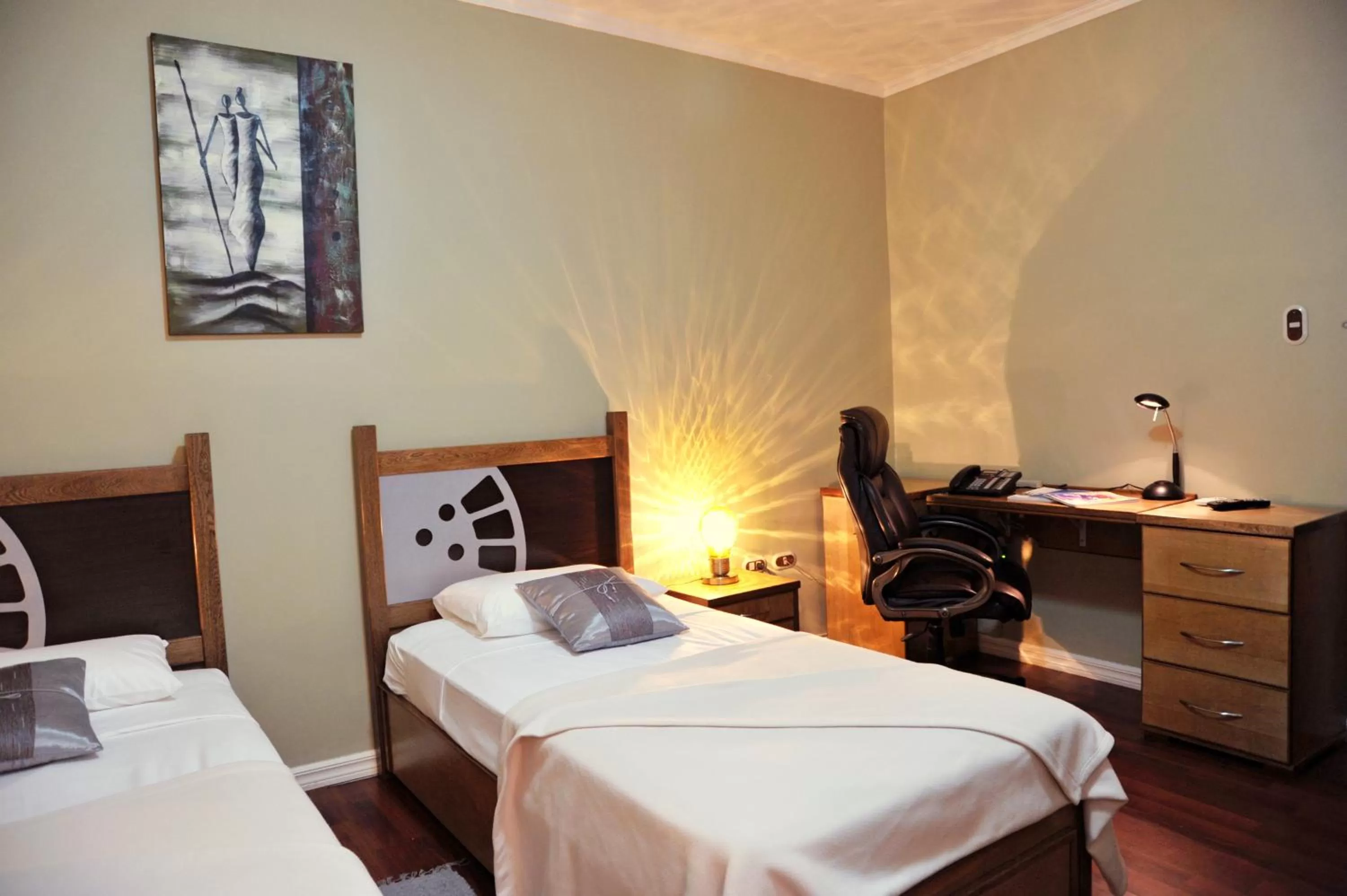 Bed in Culture Crossroads Inn