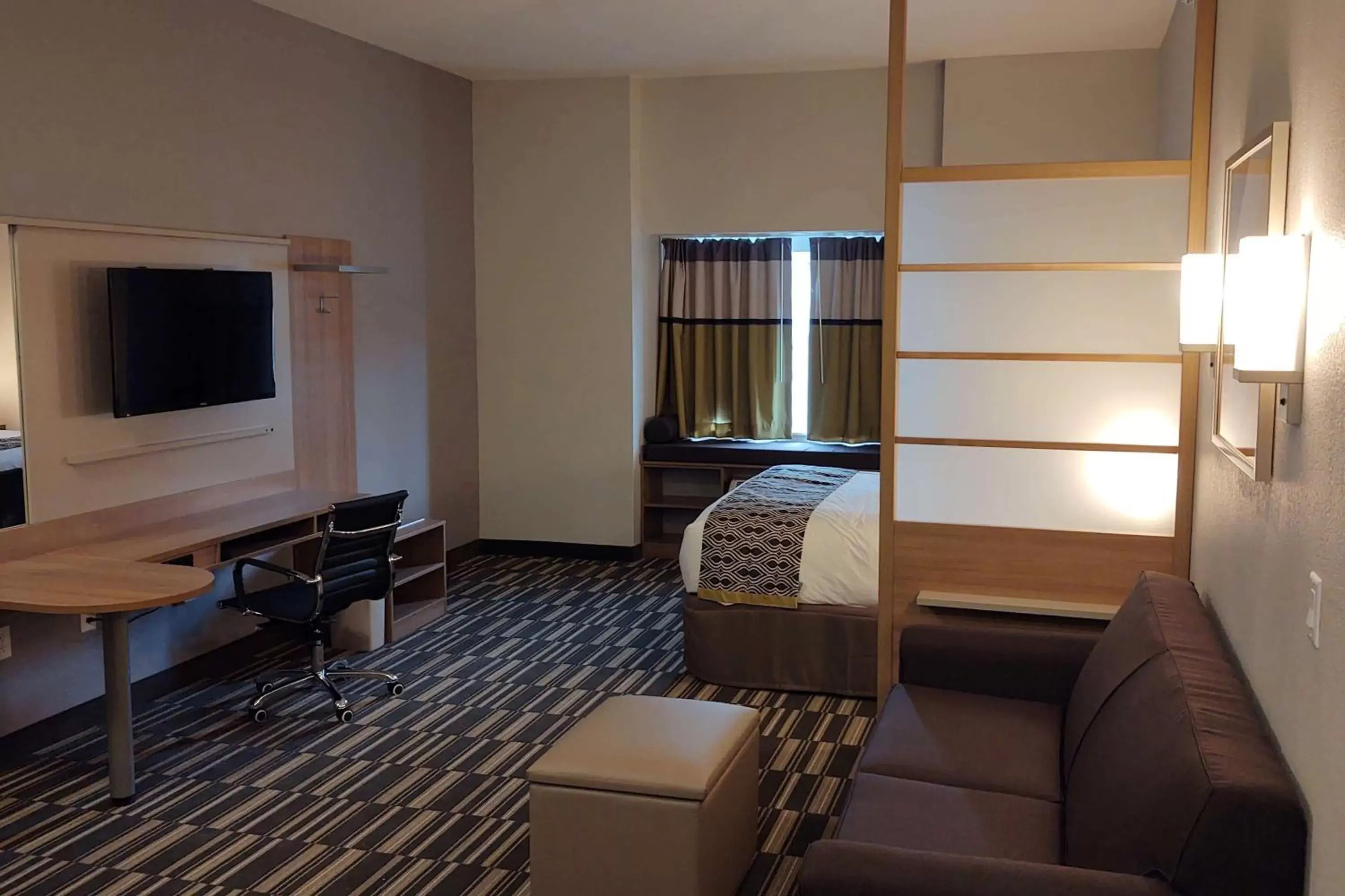Photo of the whole room, TV/Entertainment Center in Microtel Inn & Suites by Wyndham Liberty NE Kansas City Area