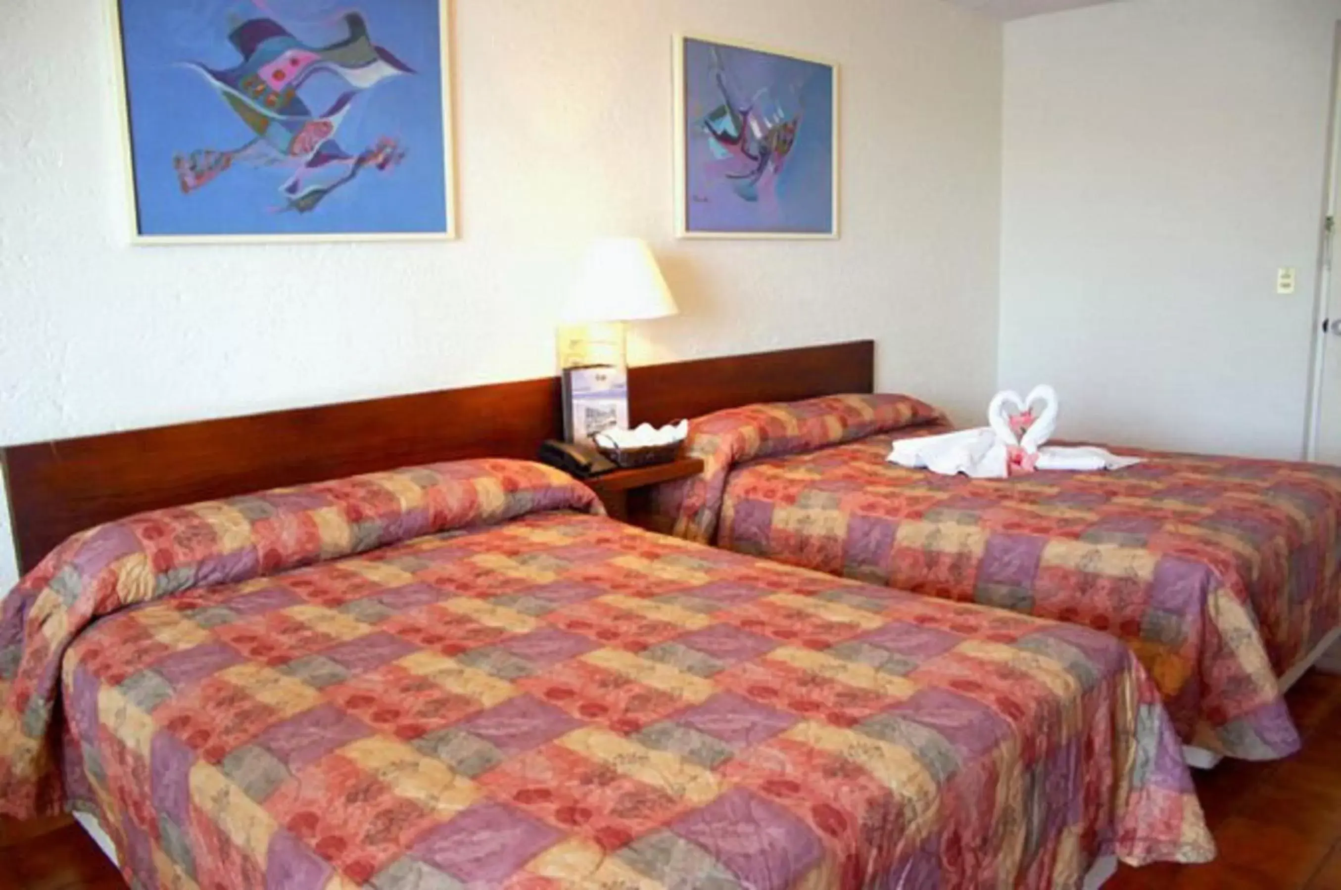 Bed in Alba Suites Acapulco