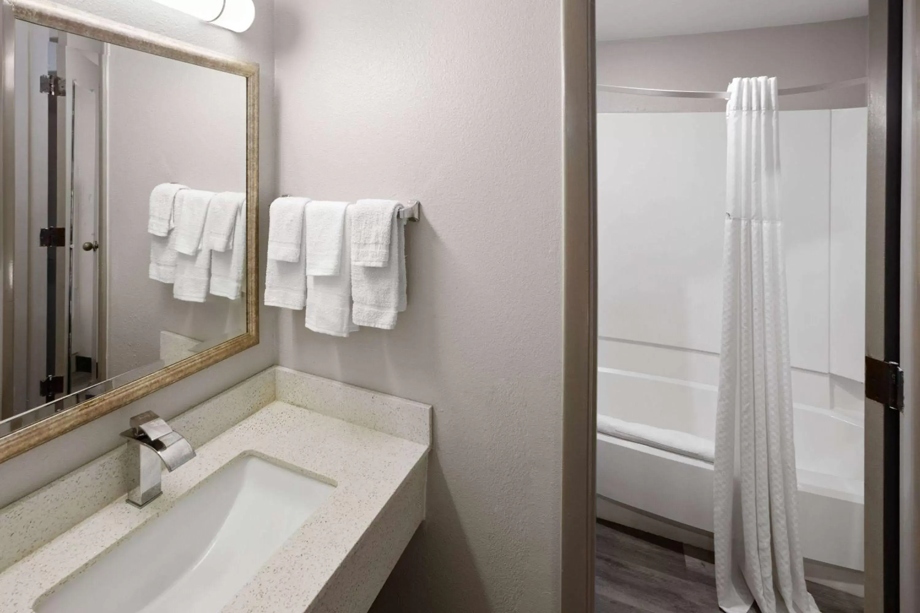 TV and multimedia, Bathroom in Days Inn & Suites by Wyndham Northwest Indianapolis