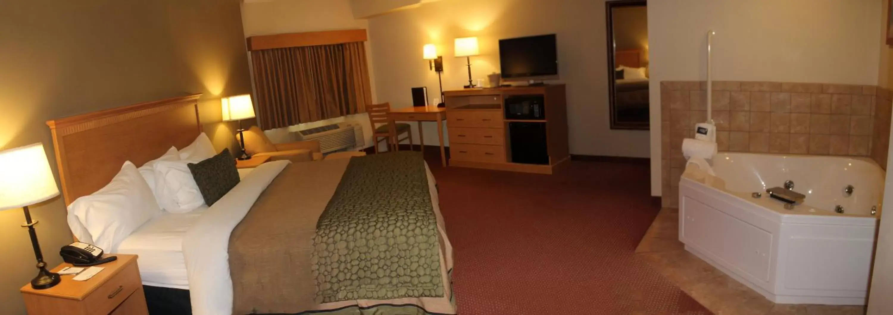 Bed in AmeriVu Inn and Suites - Waconia