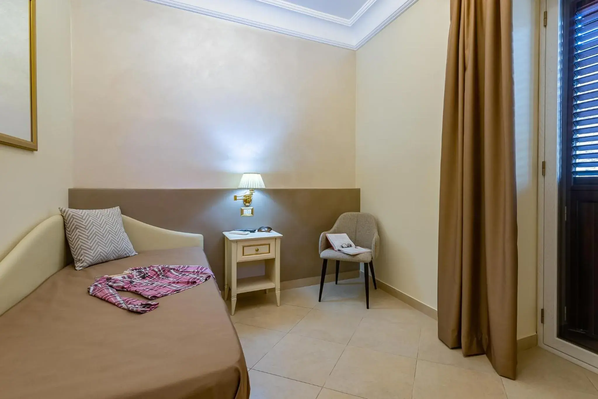 Bed in Vittorio Emanuele Boutique Hotel