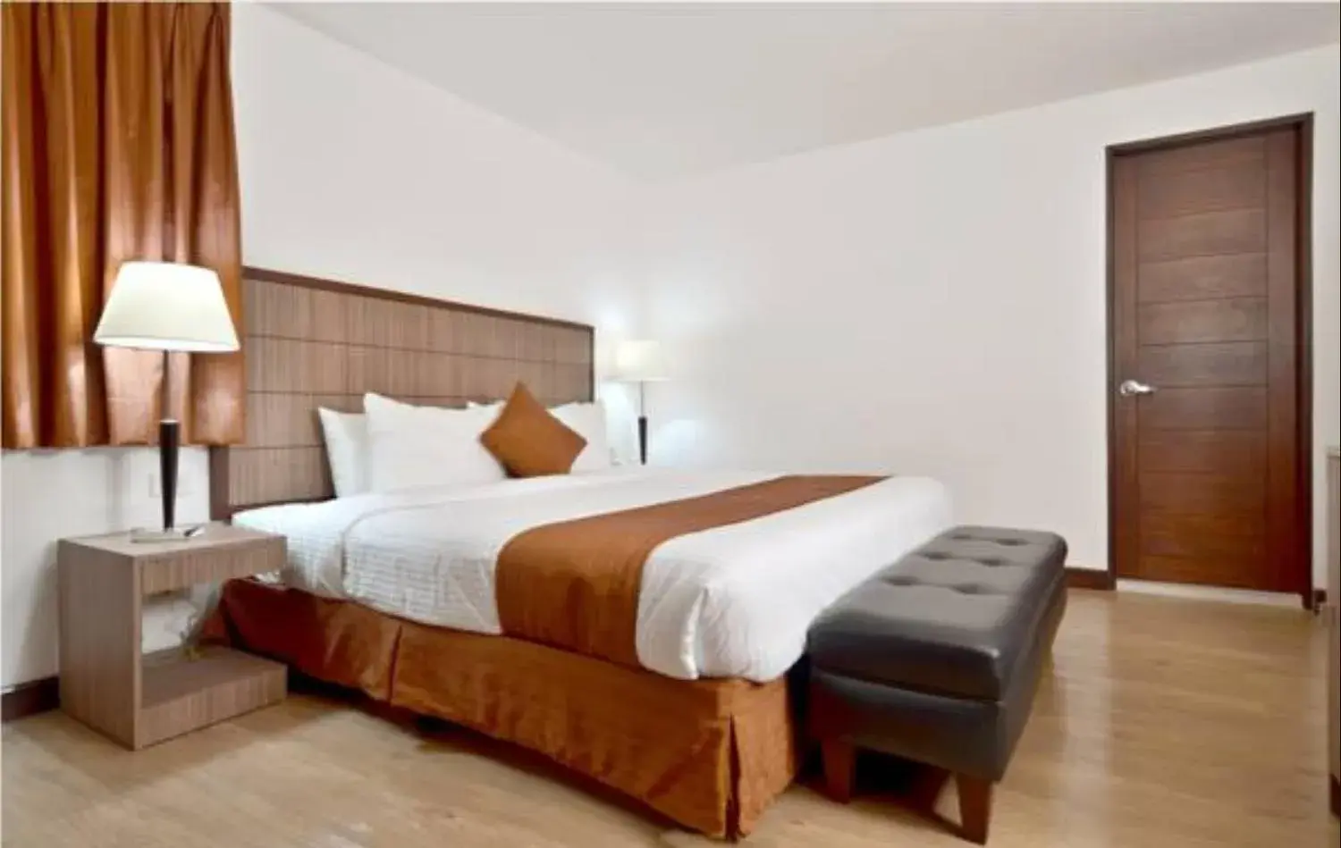 Bed in Tyche Boutique Hotel