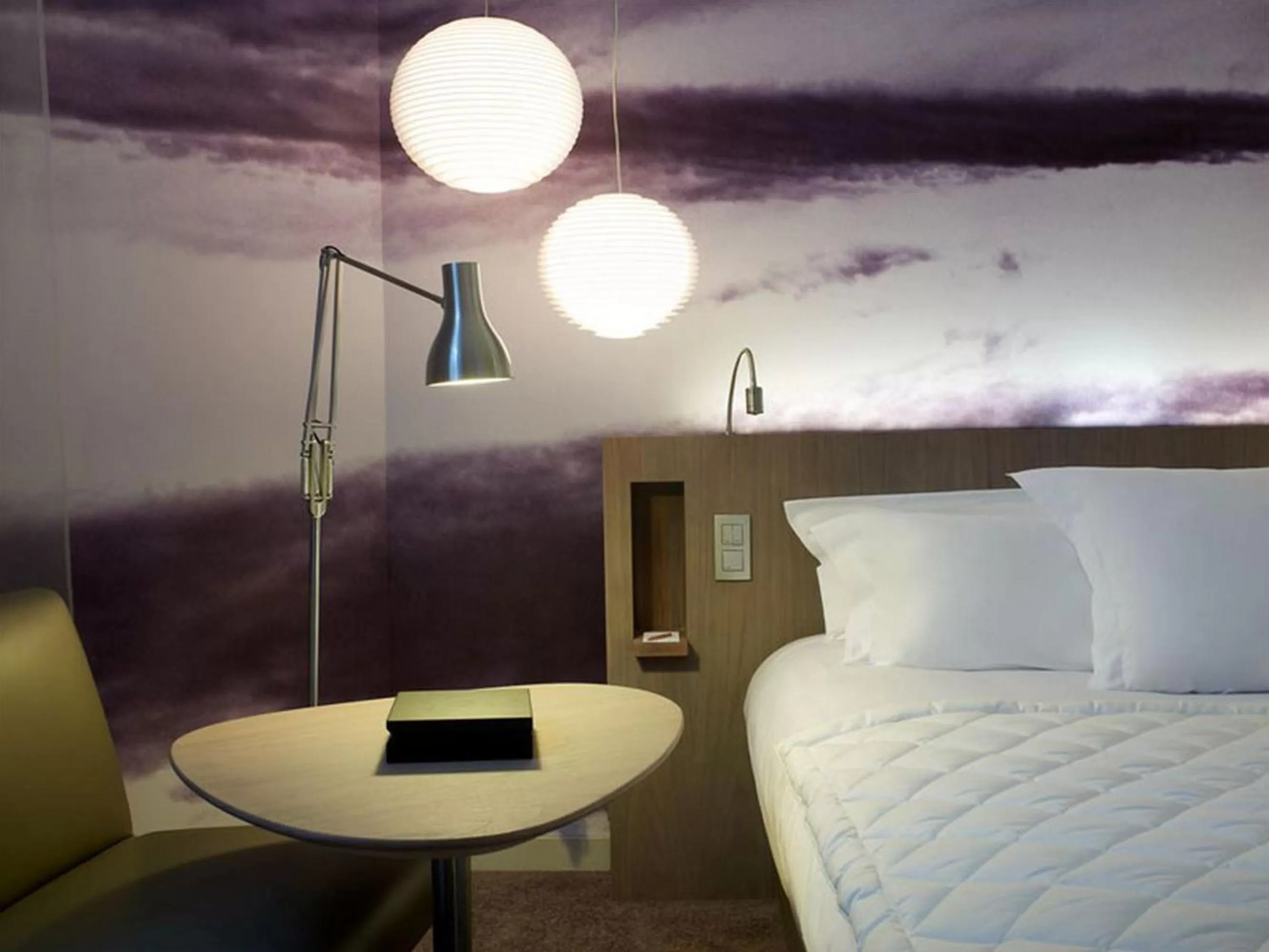 Seating area, Bed in Le Grand Balcon Hotel