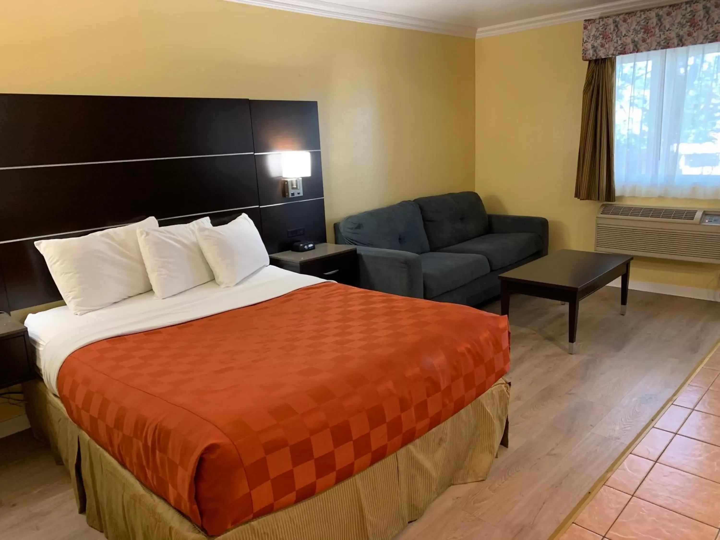 Bed in Olive Tree Inn & Suites