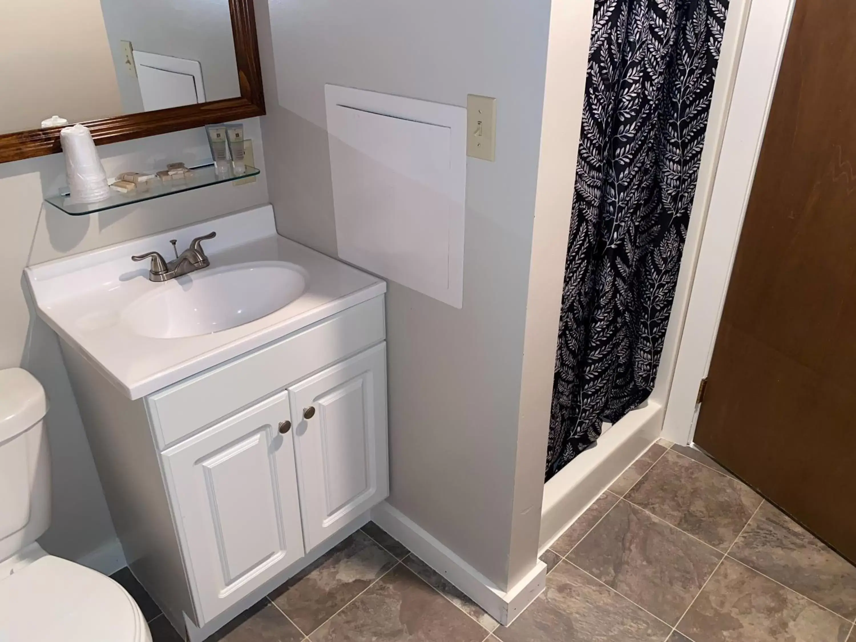 Bathroom in Lake Ontario Motel & Inn