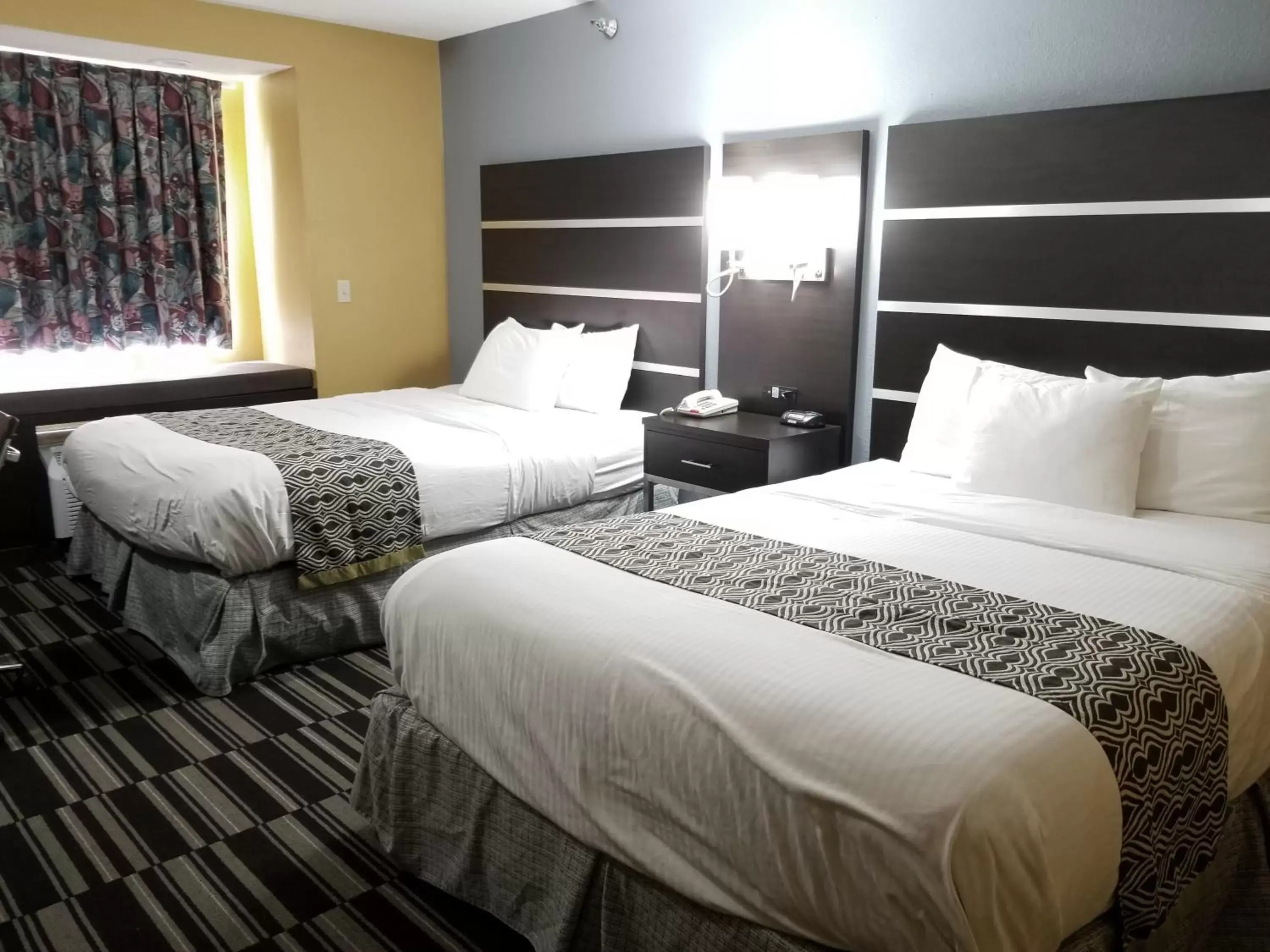 Bed in Microtel Inn & Suites by Wyndham Riverside