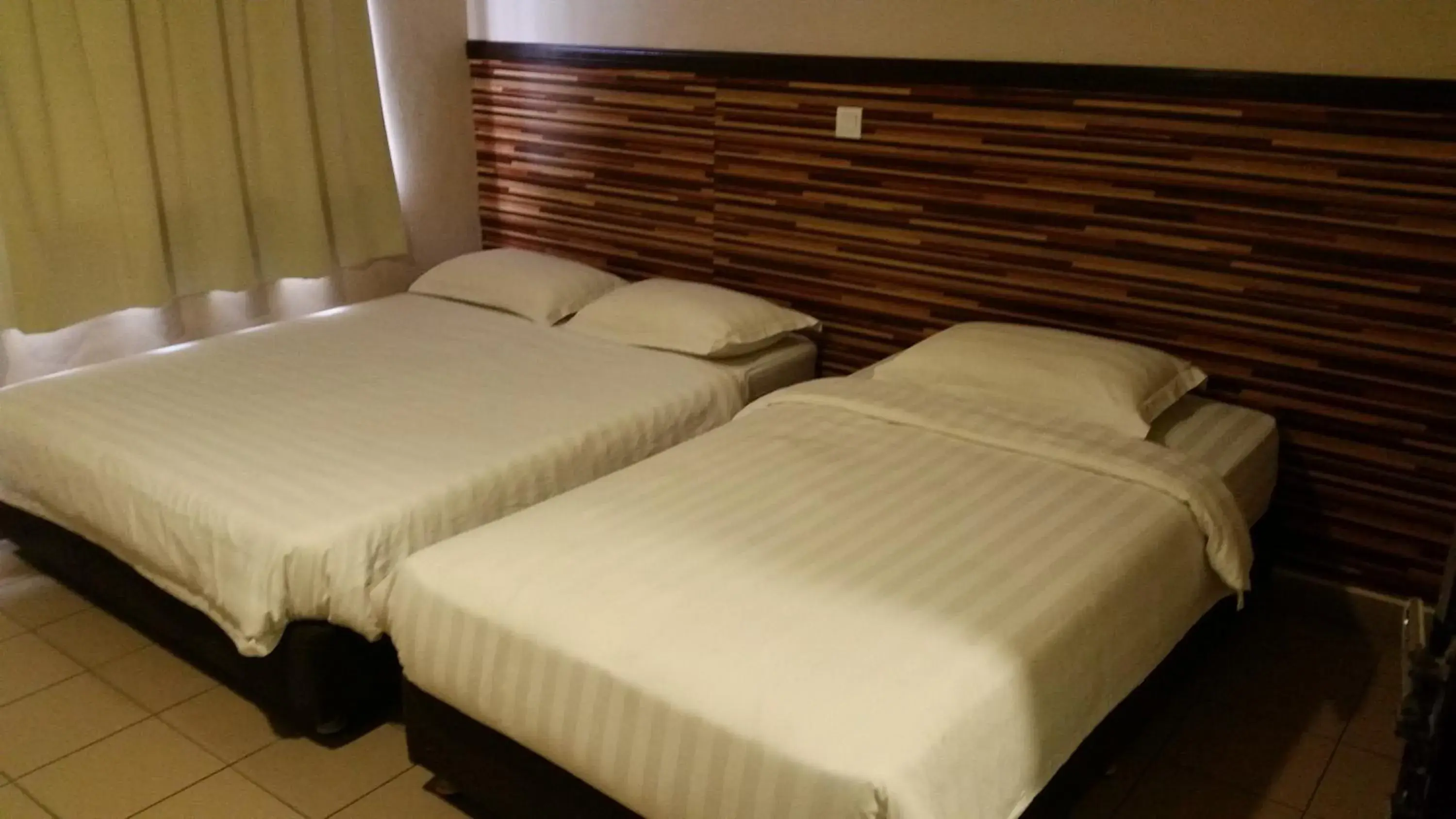 Bed in Iskandar Hotel
