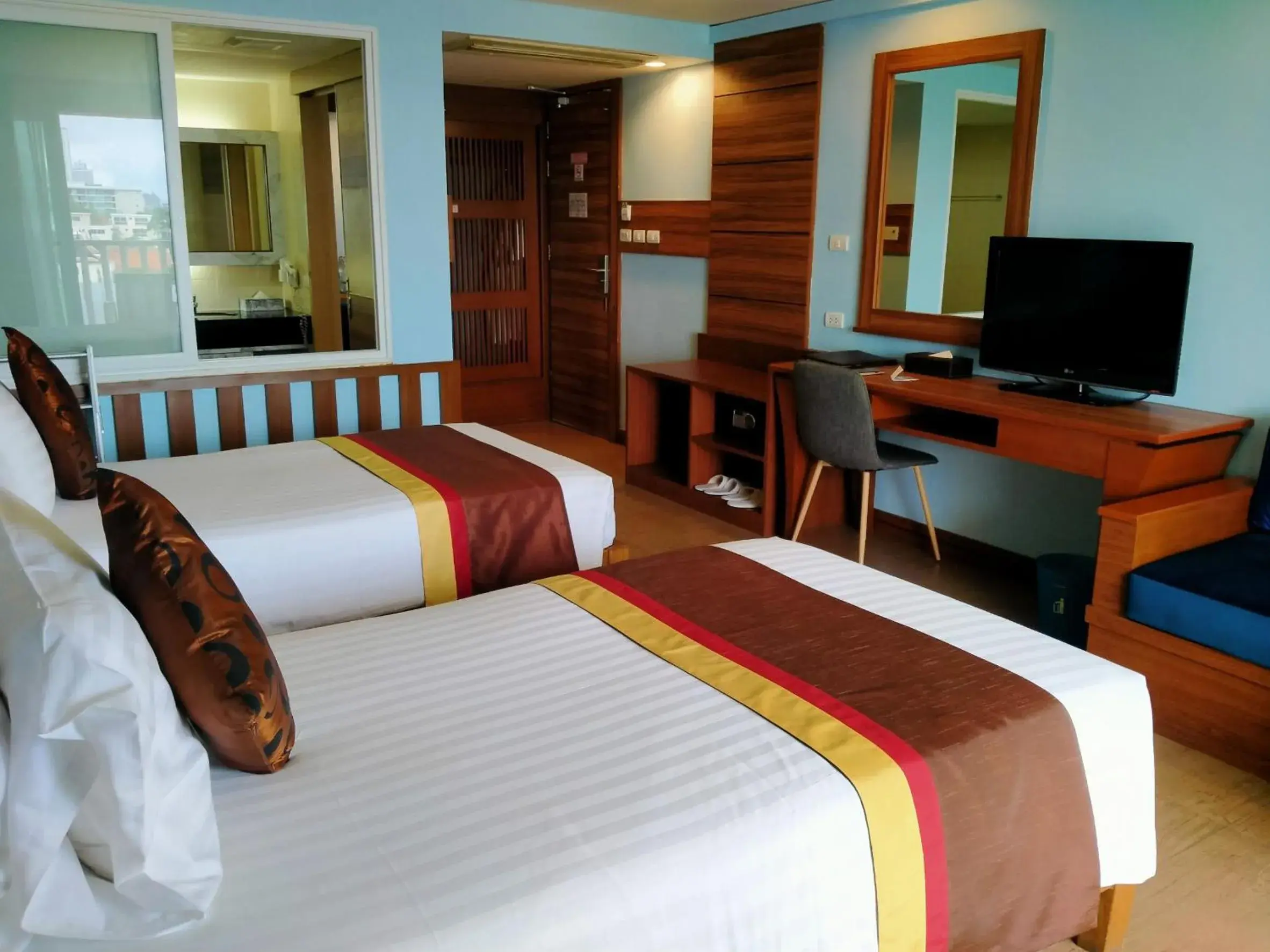 Bed in Saisawan Beach Resort