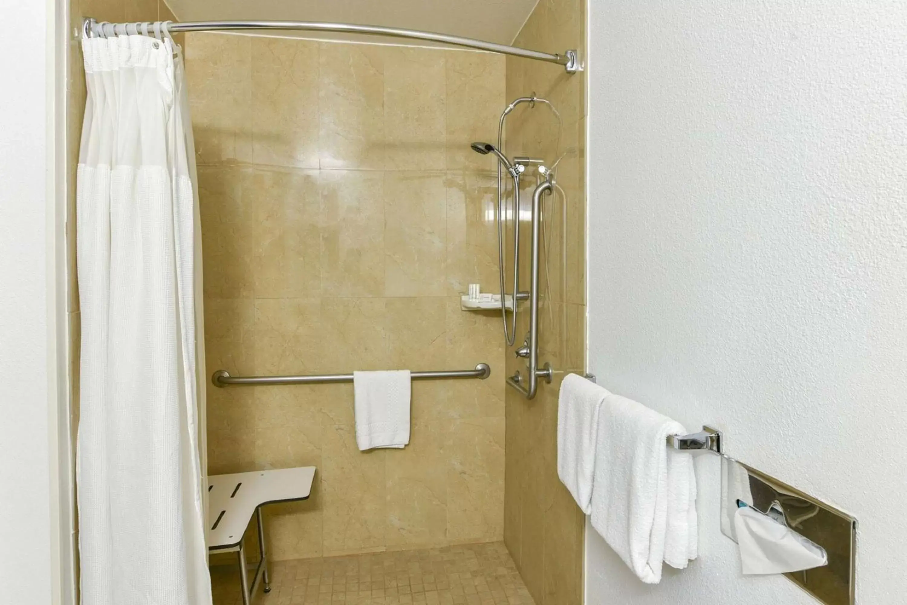 Bathroom in SureStay Hotel by Best Western Ontario Airport