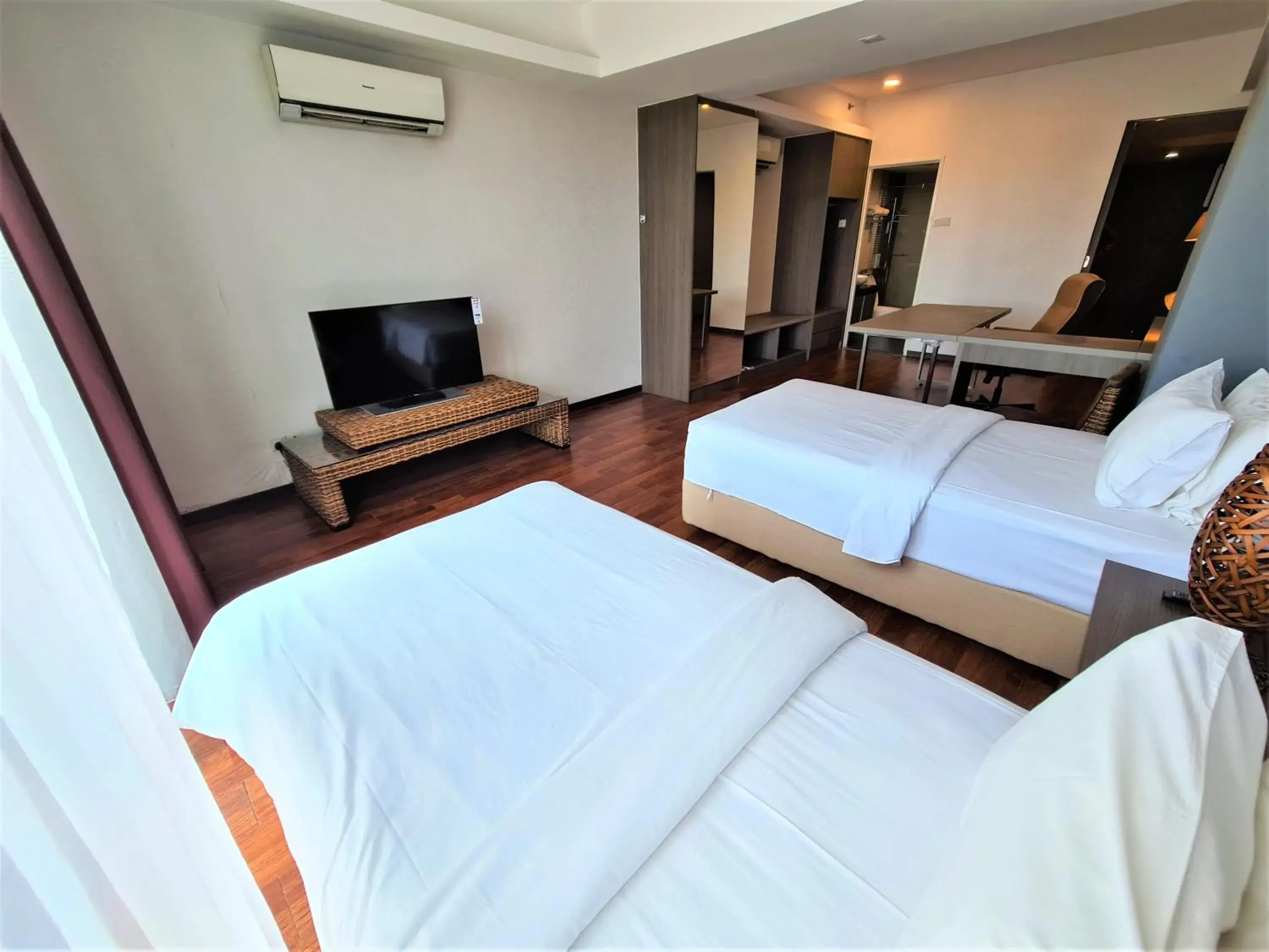 Bed in Nexus Regency Suites & Hotel