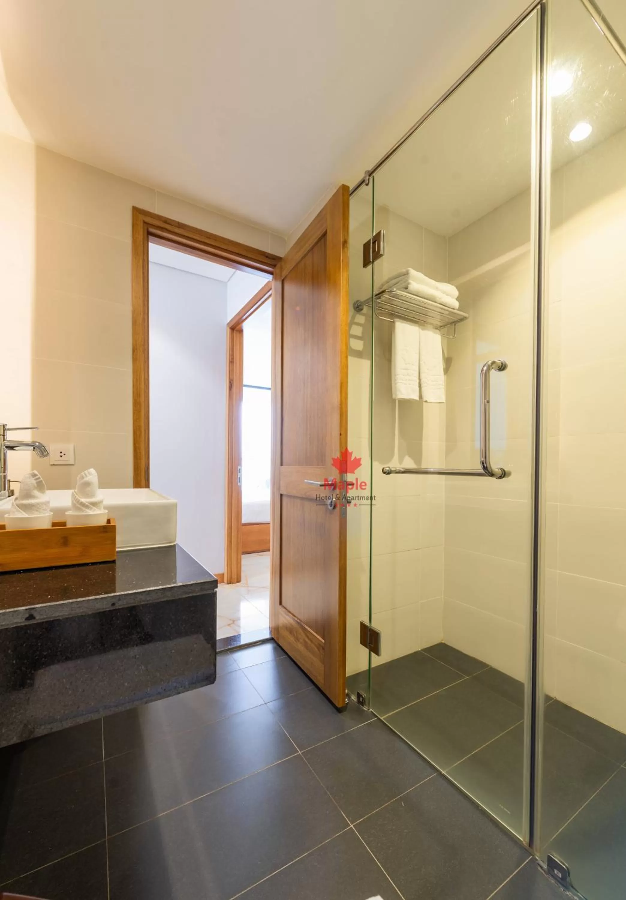 Bathroom in Maple Hotel & Apartment