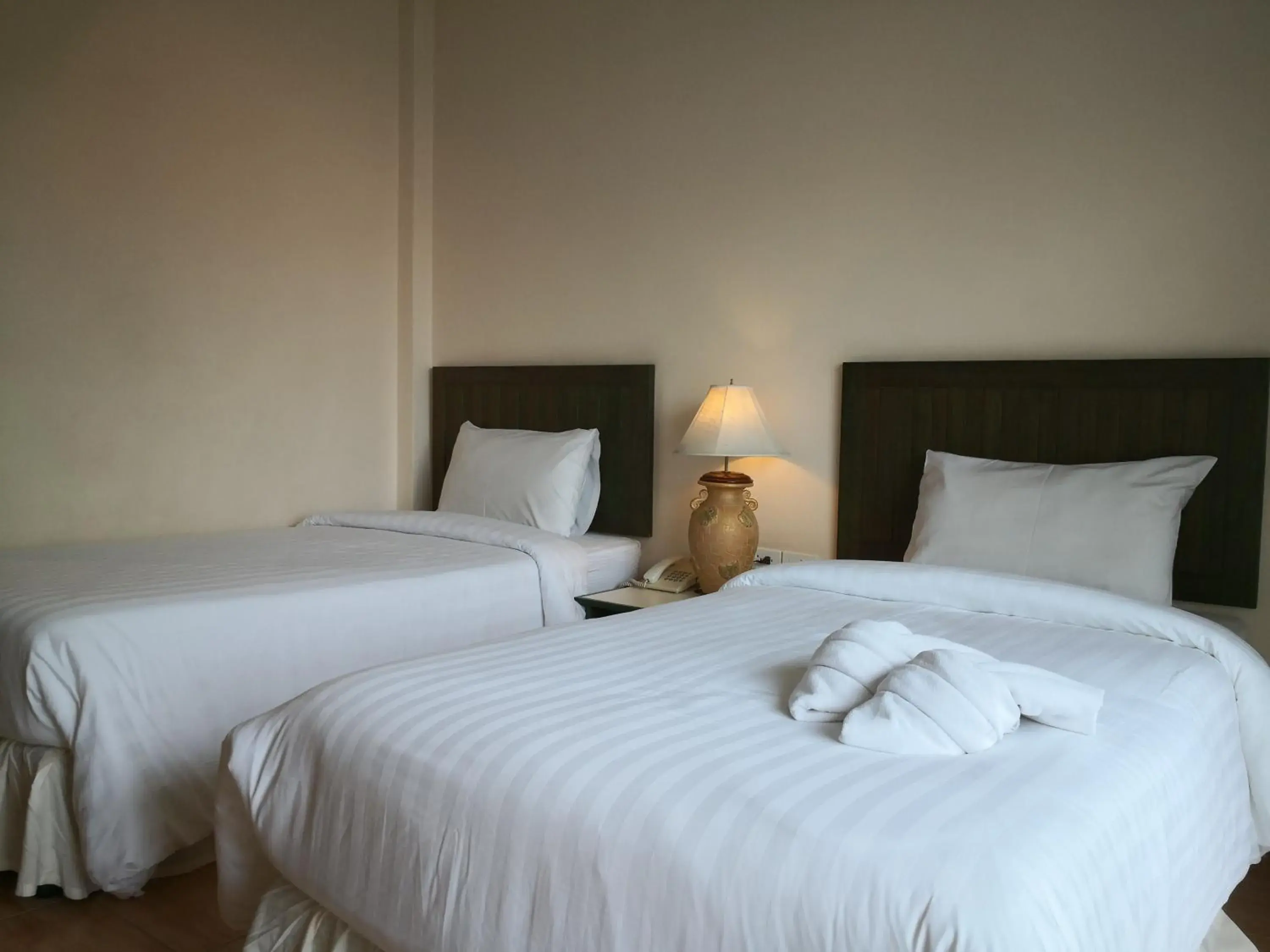 Bed in Baan Suksiri Hotel Bed in Baan Suksiri Hotel