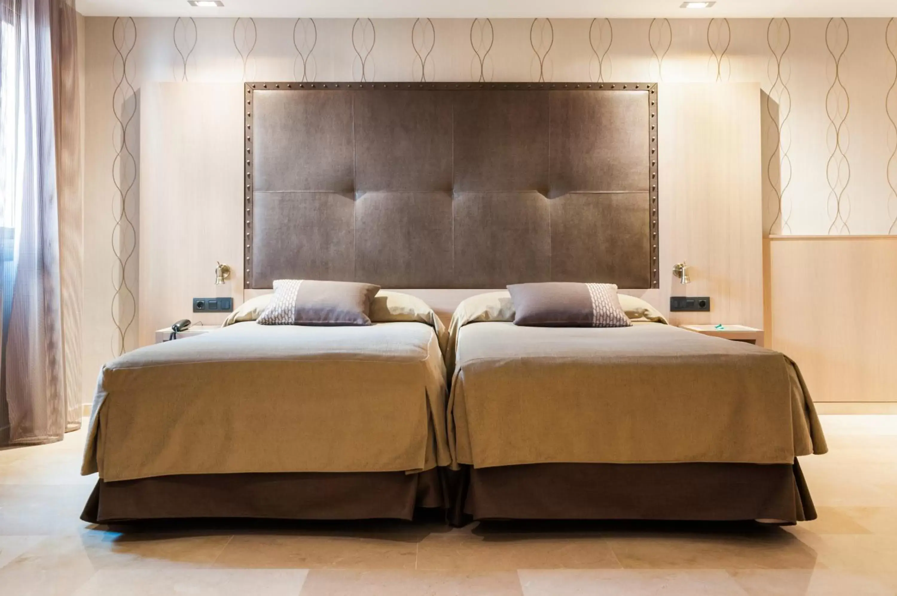 Bed in Gran Hotel Barcino