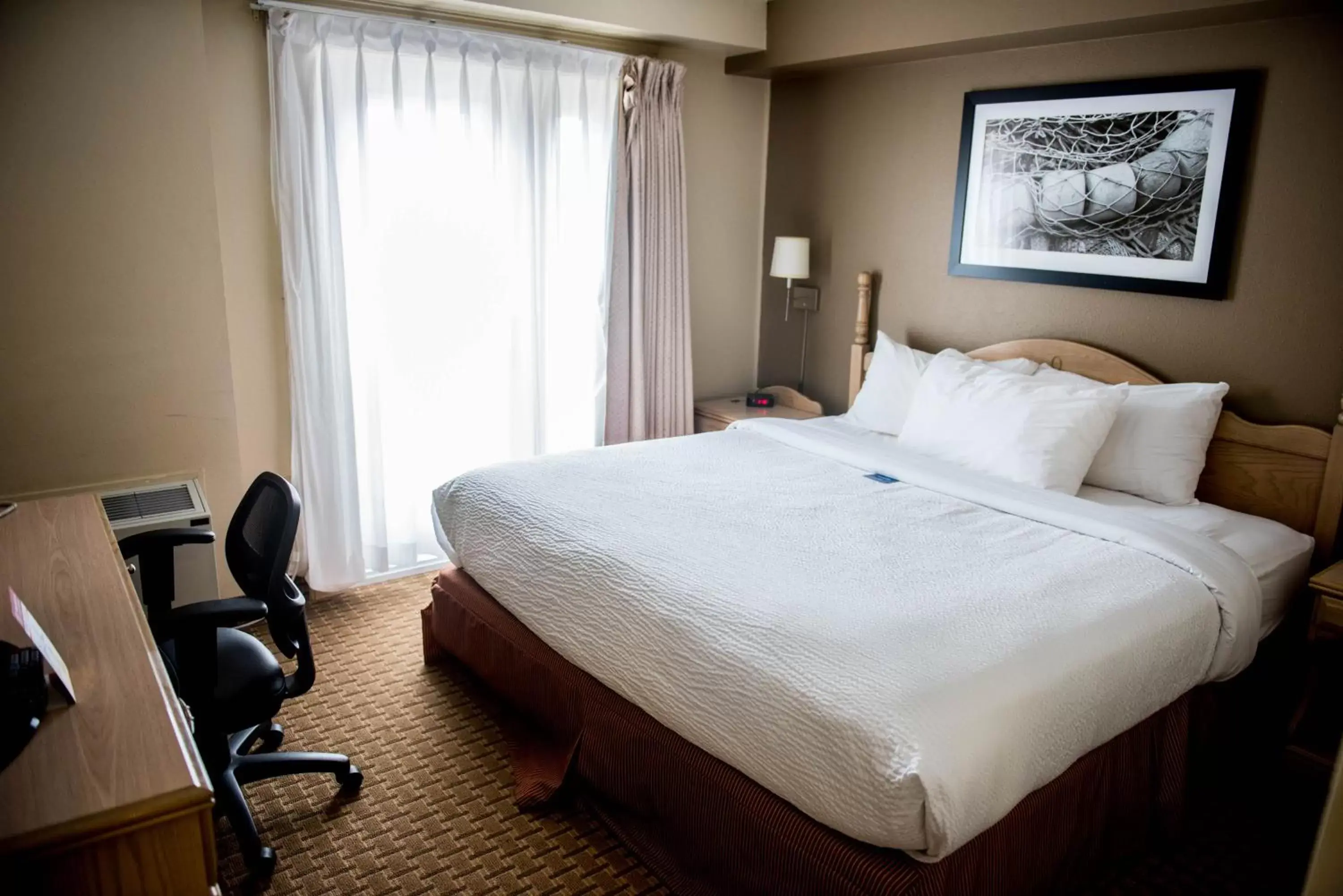 Bed in Travelodge Suites by Wyndham Moncton