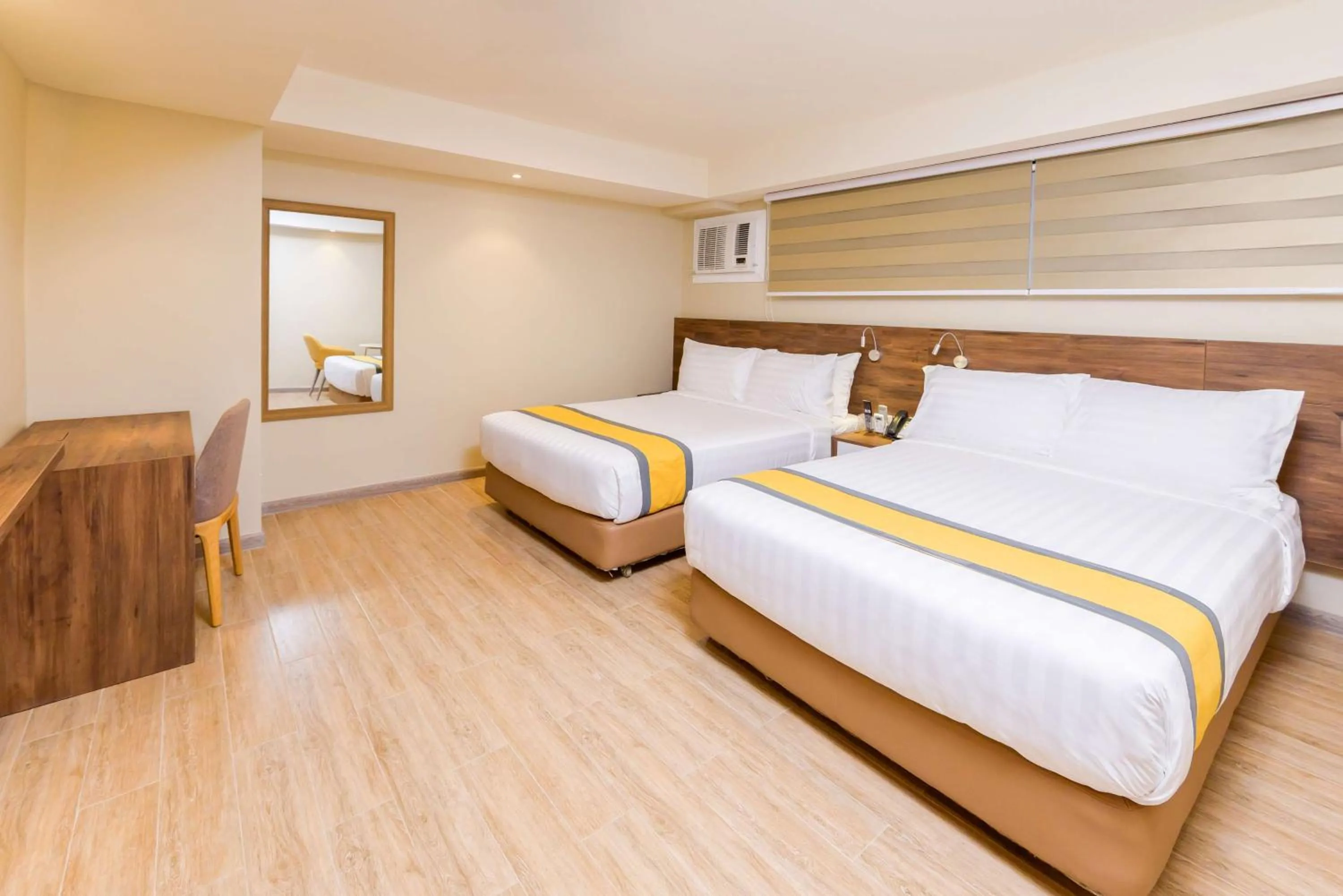 Photo of the whole room, Bed in SureStay Plus by Best Western Cebu City