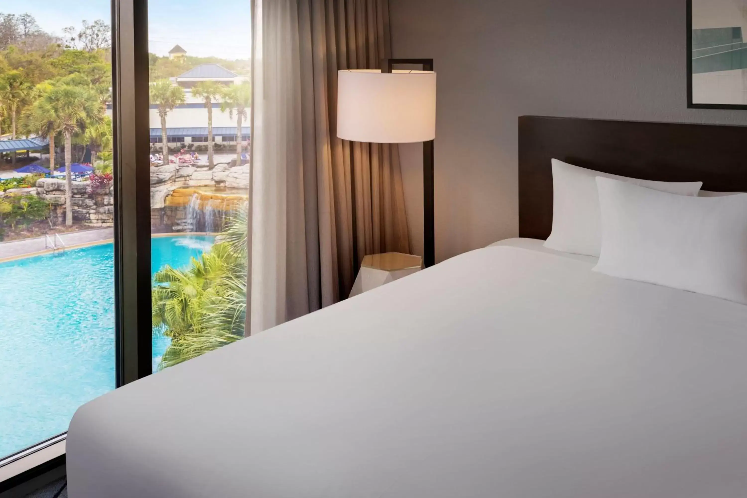 Swimming pool, Bed in Delta Hotels by Marriott Orlando Celebration - Newly Renovated!