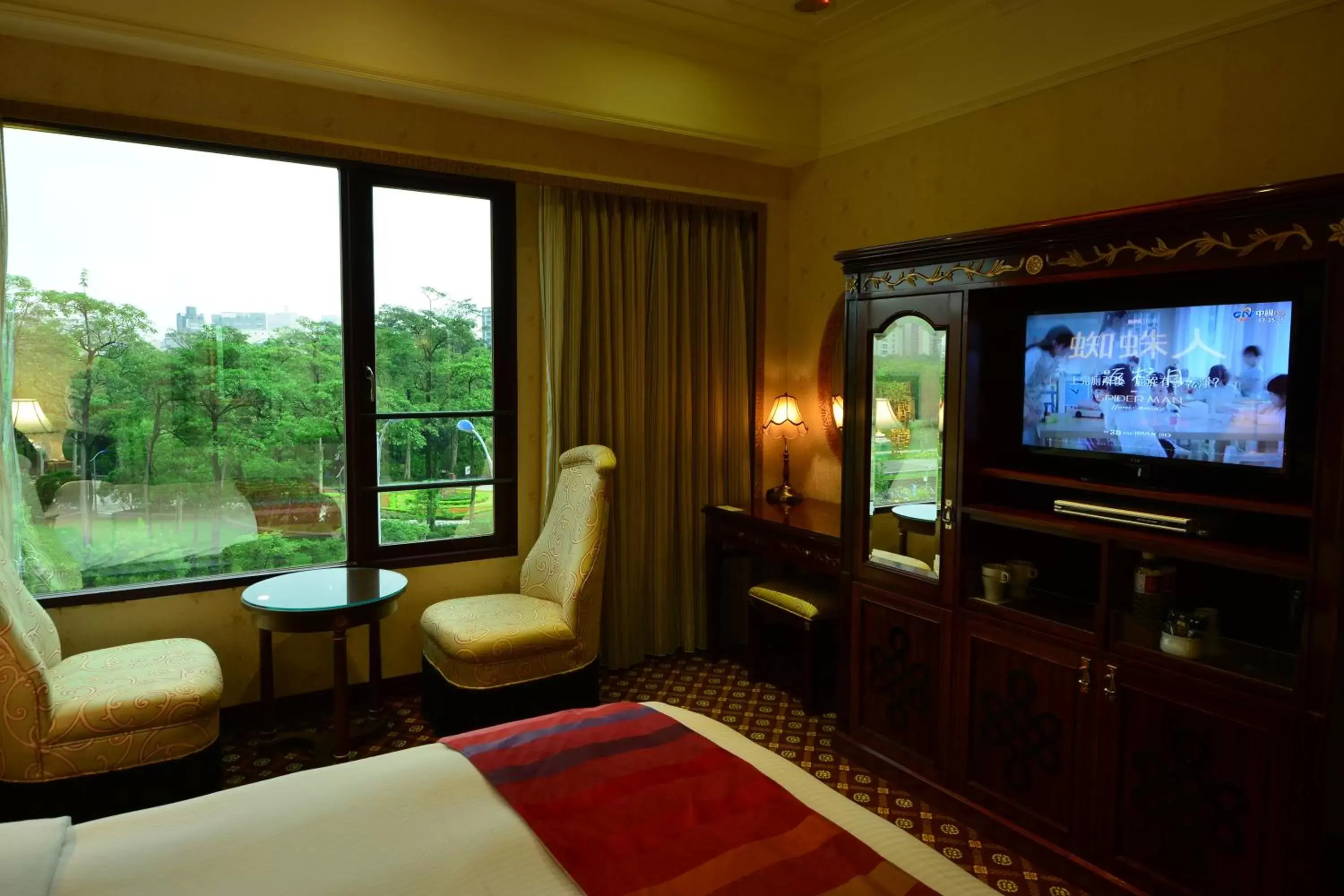 Photo of the whole room, TV/Entertainment Center in Rido Hotel