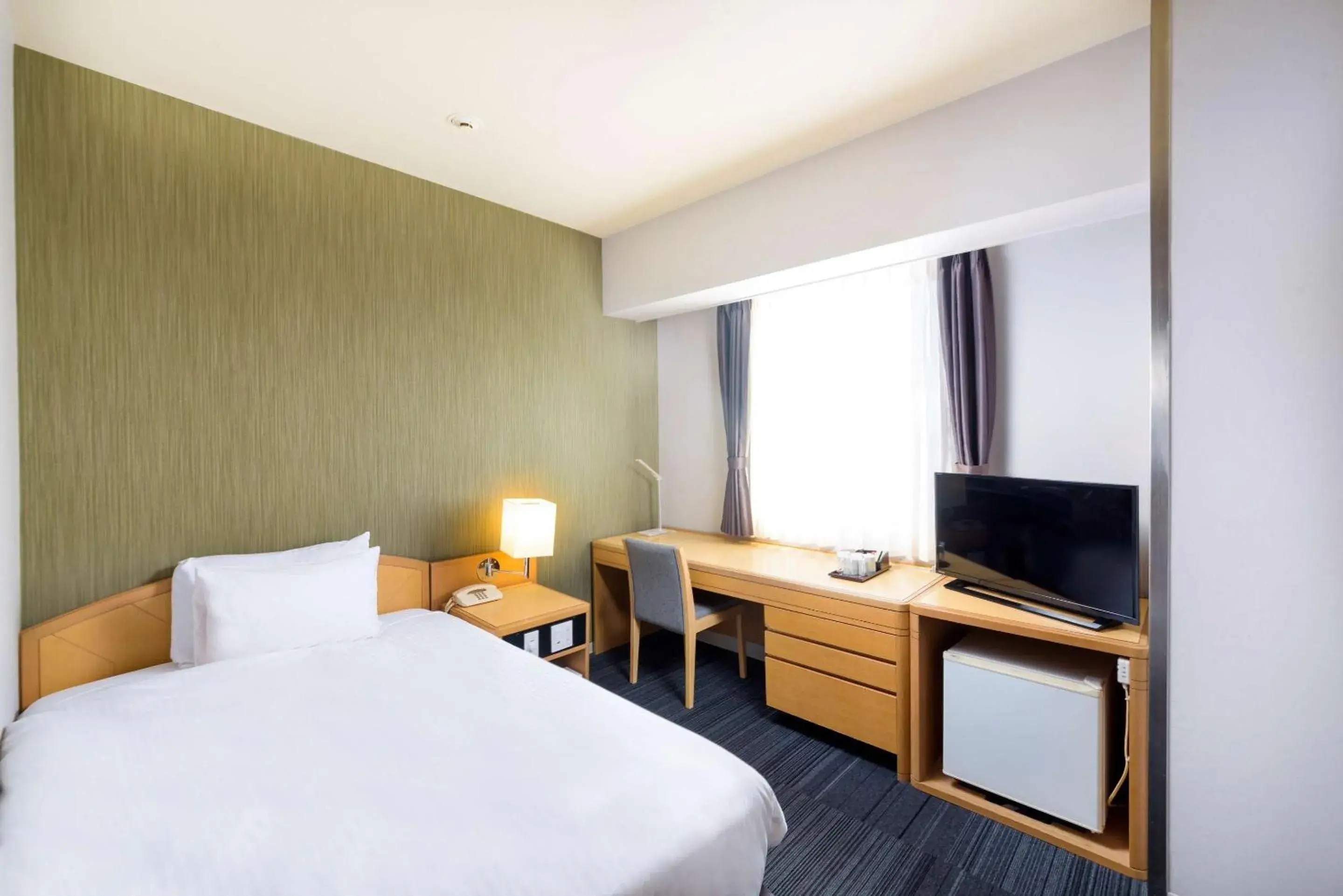 Bedroom, Bed in SureStay Plus Hotel by Best Western Shin-Osaka