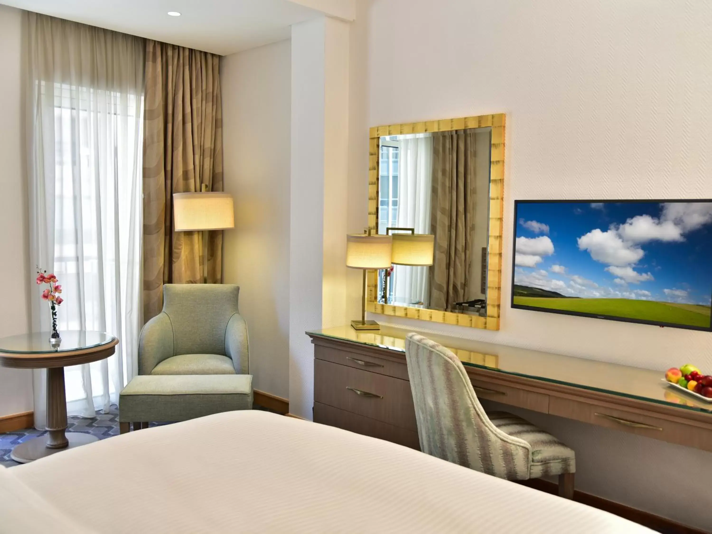 Bed, TV/Entertainment Center in Gefinor Rotana – Beirut