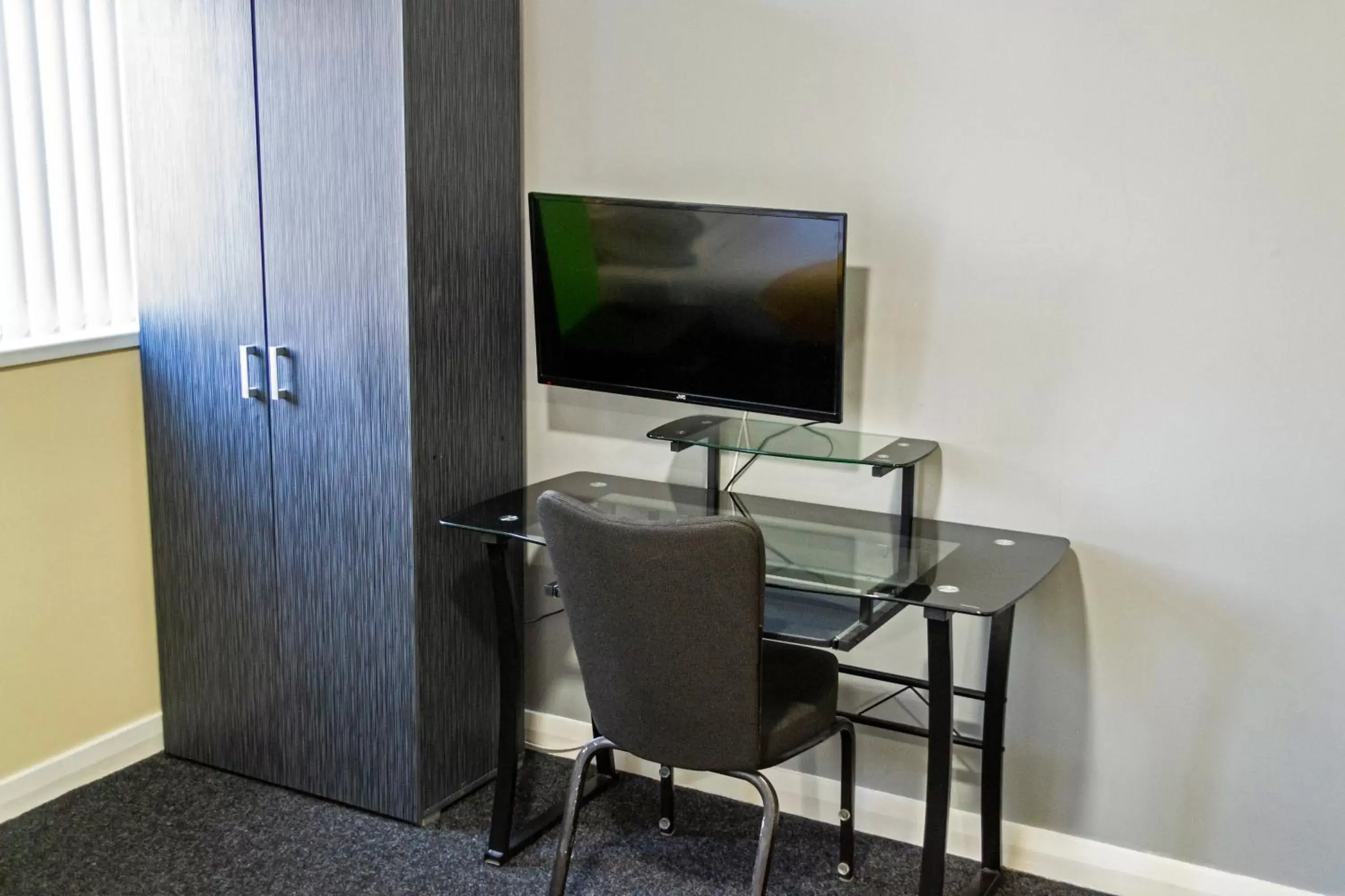 Seating area, TV/Entertainment Center in Lymedale Suites Studios & Aparthotel in NEWCASTLE UNDER LYME & STOKE