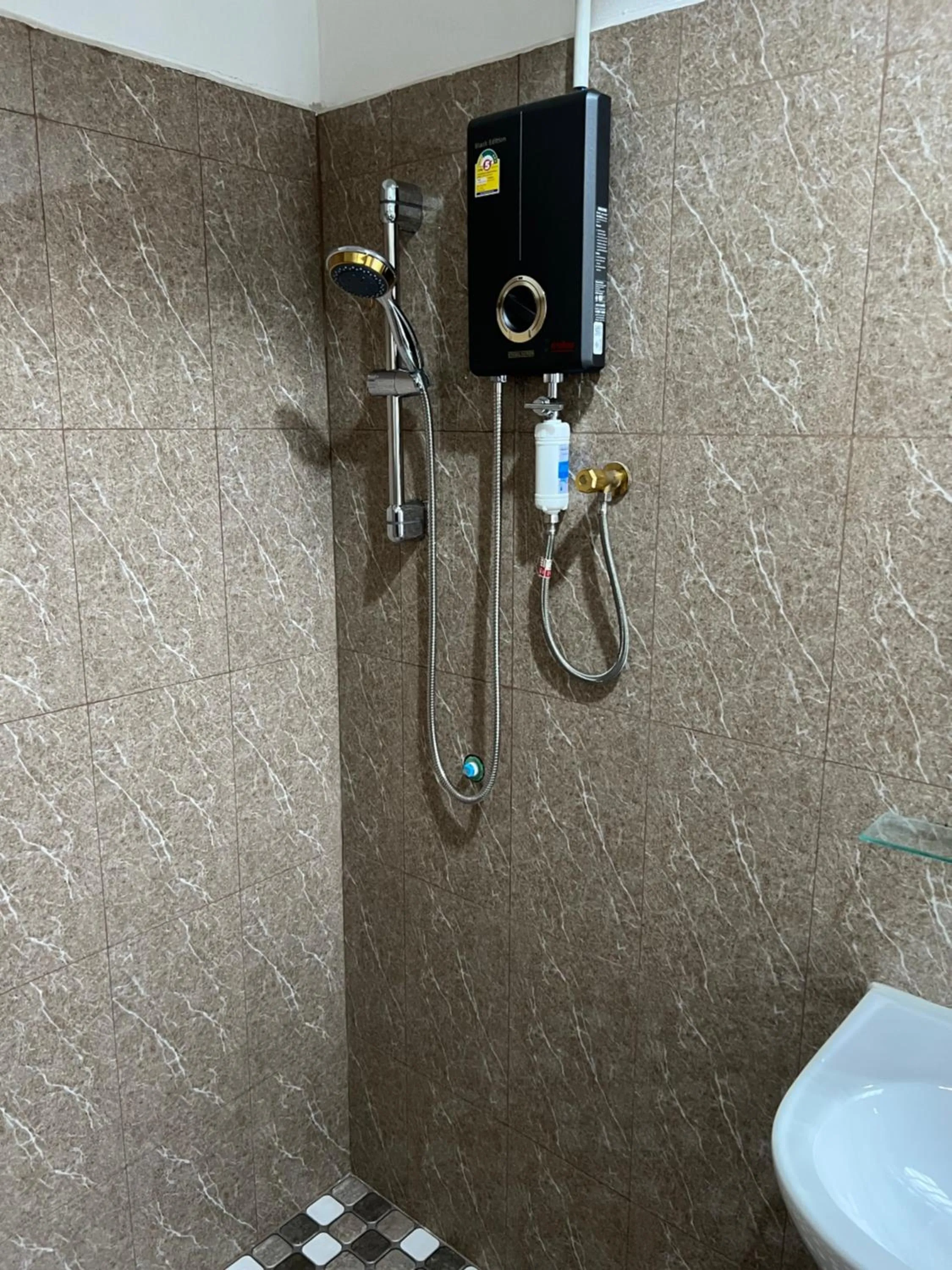 Shower in Mall Suites Hotel