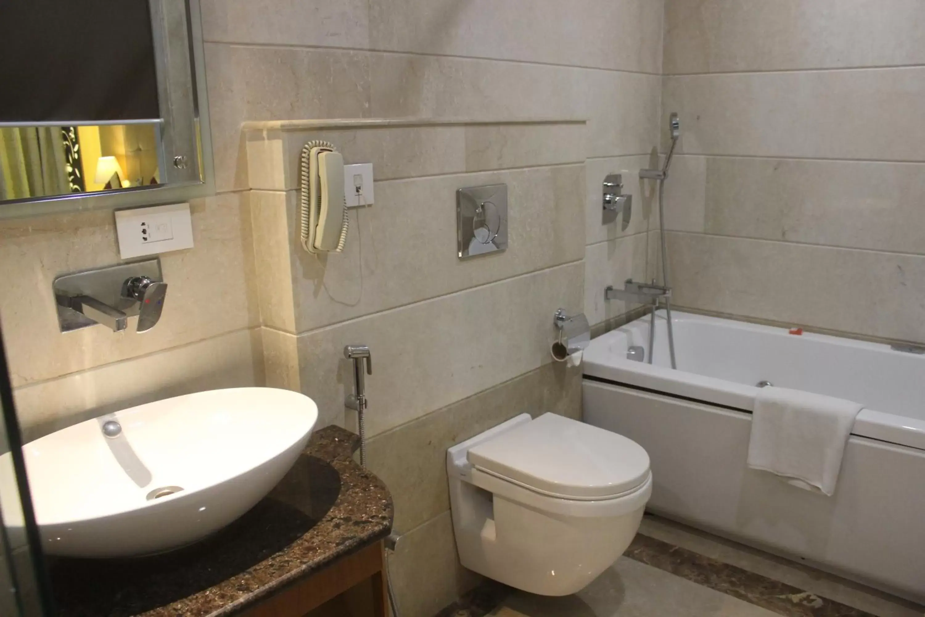 Bathroom in Ramada by Wyndham Varanasi Katesar