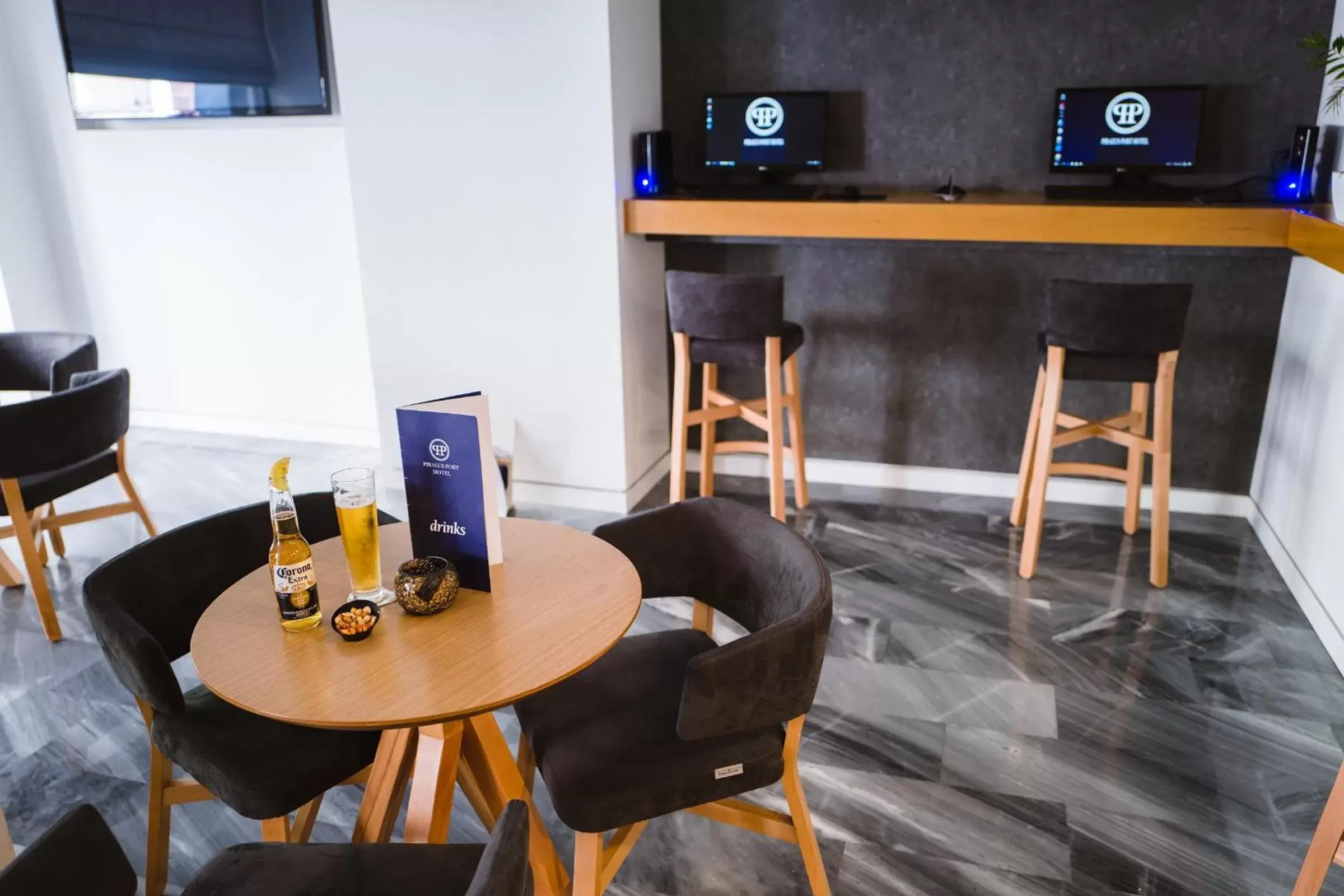 Communal lounge/ TV room, Dining Area in Piraeus Port Hotel