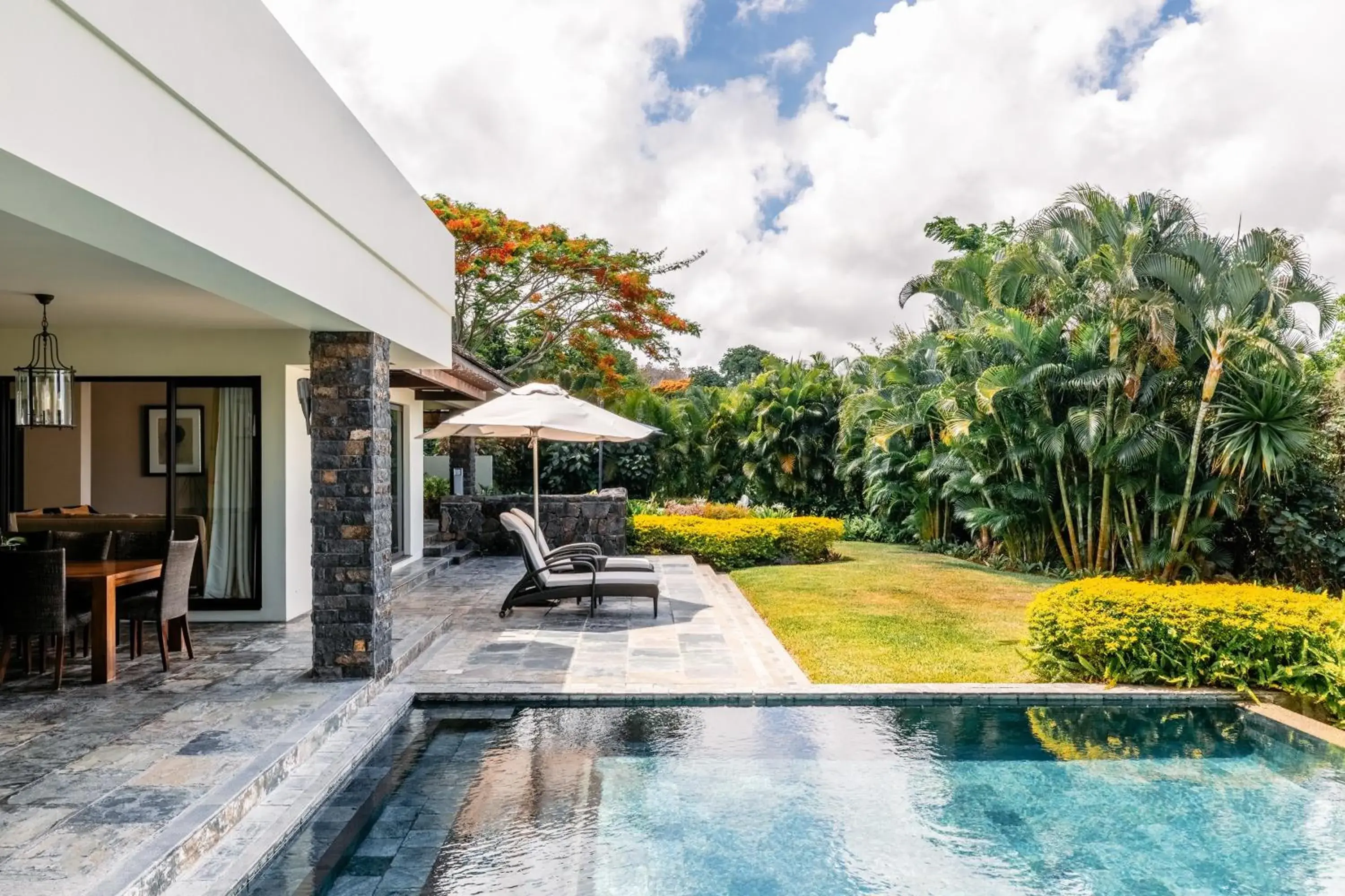 Patio, Swimming Pool in Four Seasons Resort Mauritius at Anahita