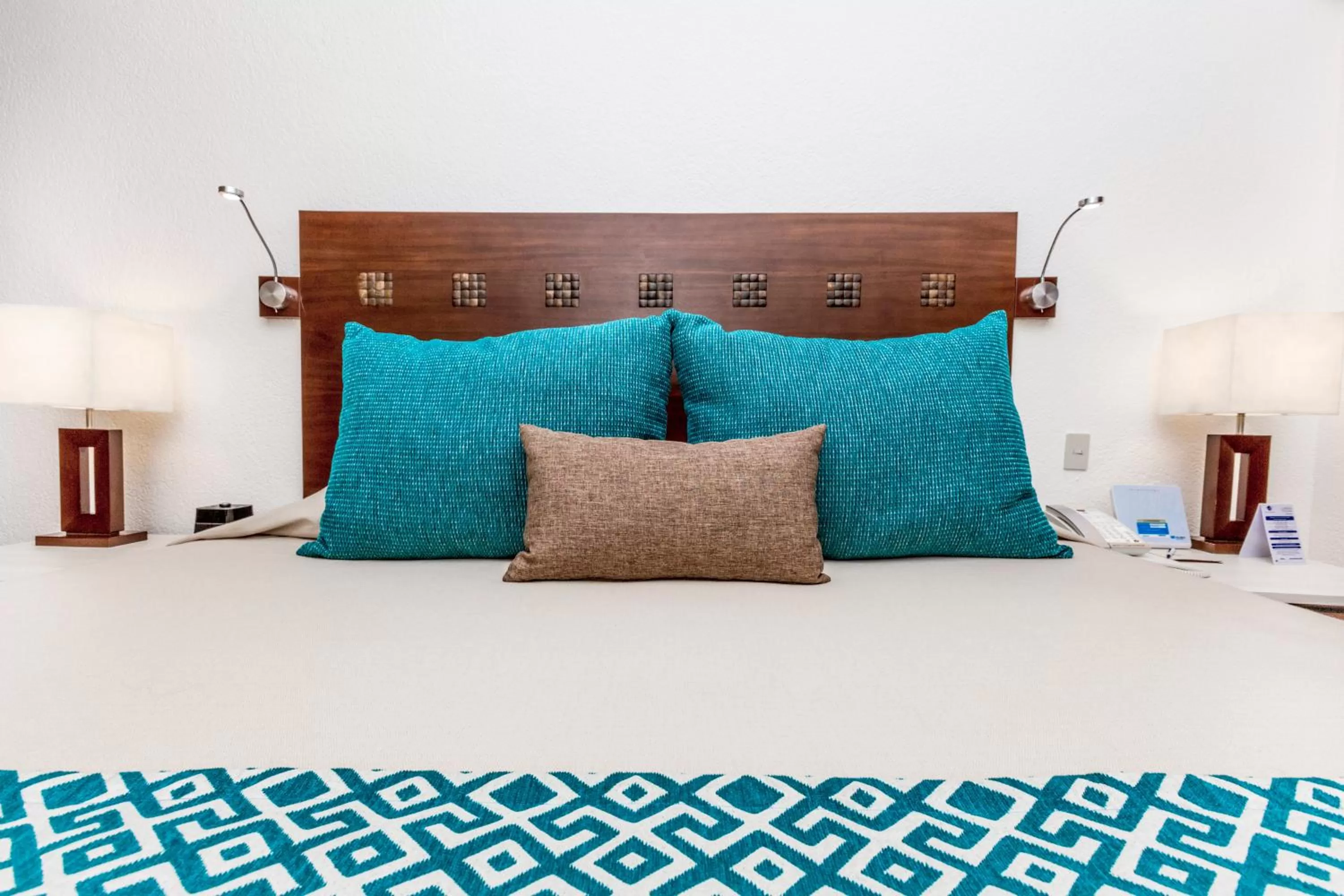 Bed in The Royal Cancun All Suites Resort