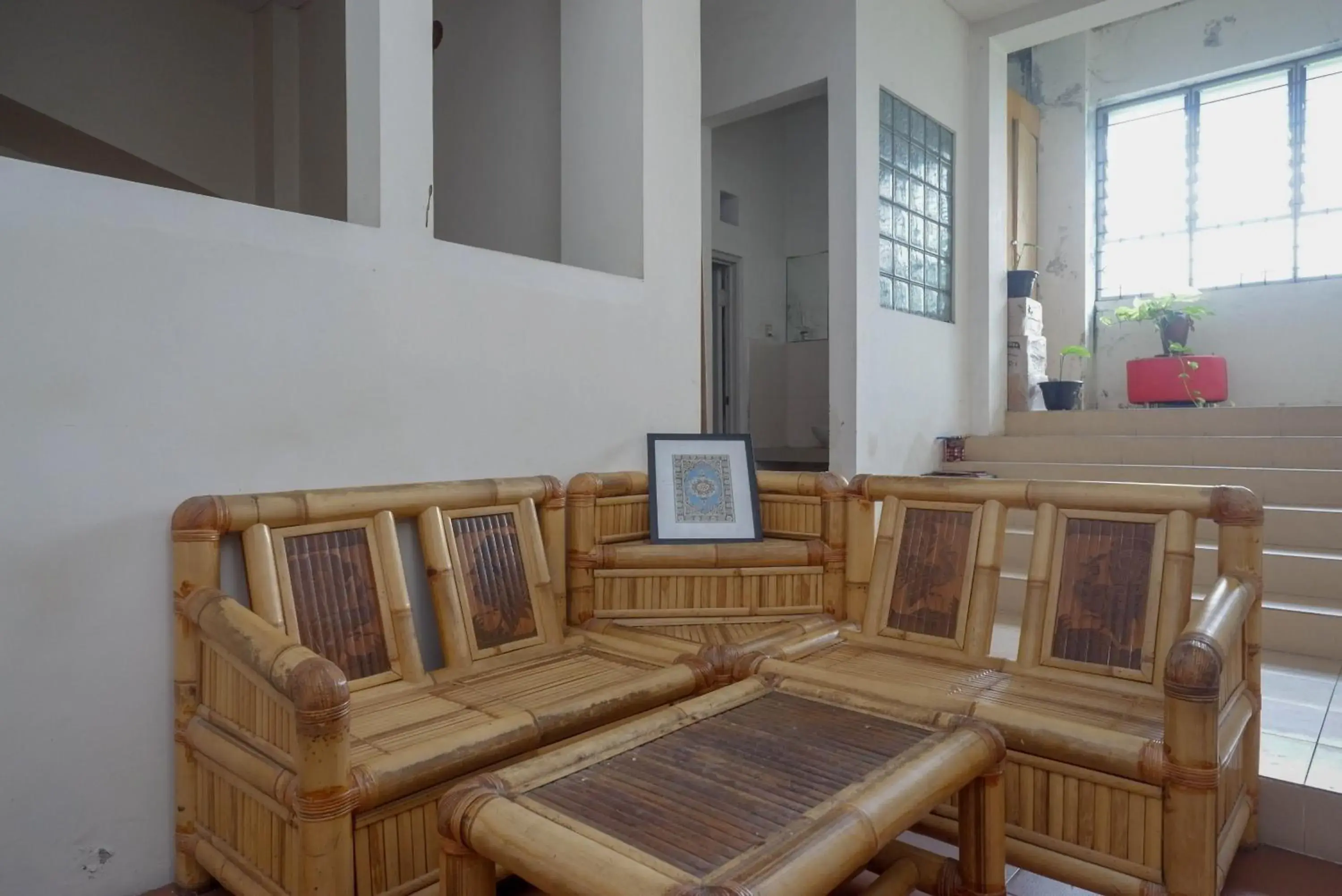 Seating Area in RedDoorz Syariah At Namira Hotel