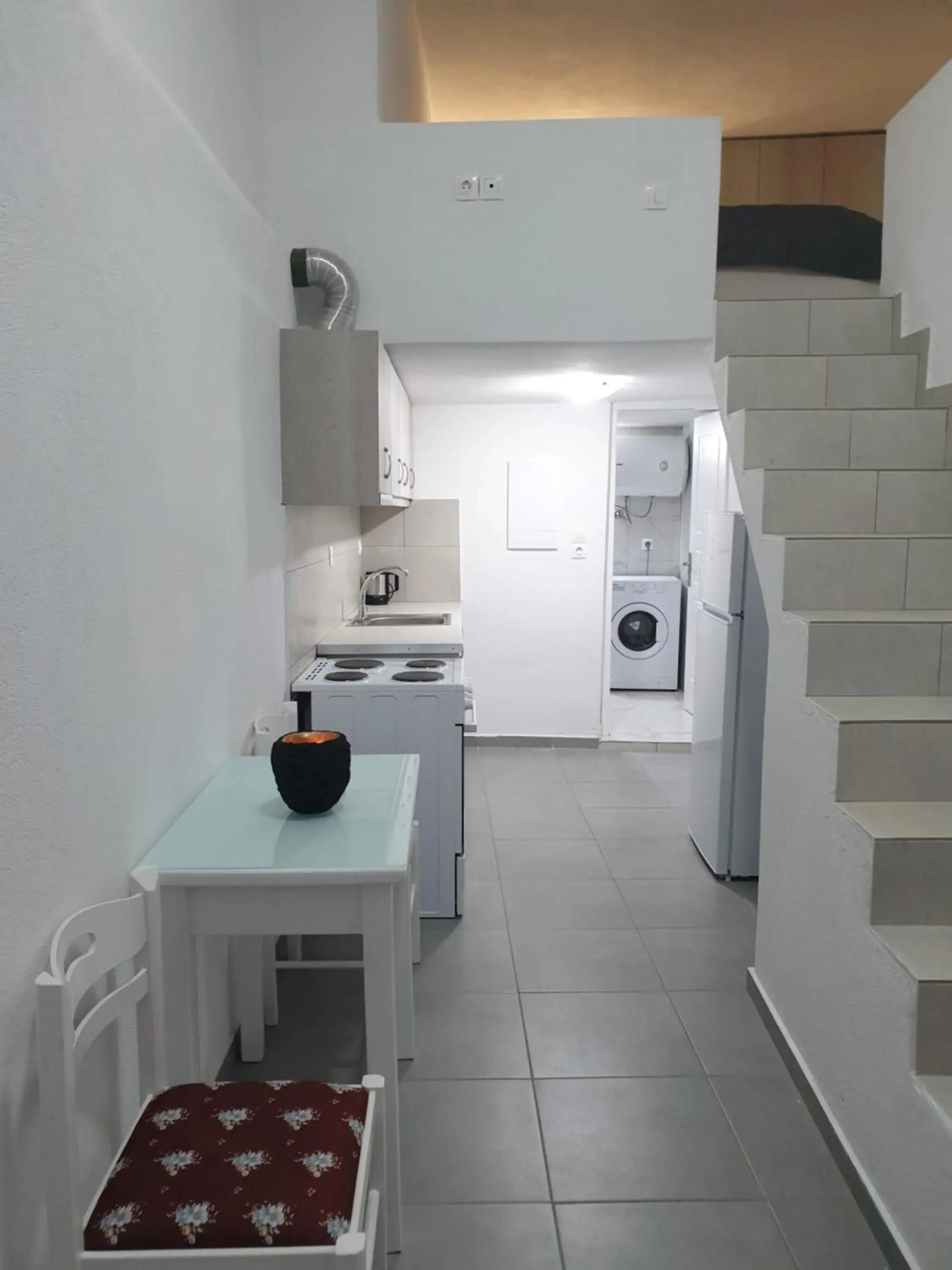 Seating area, Kitchen/Kitchenette in Porto Castello