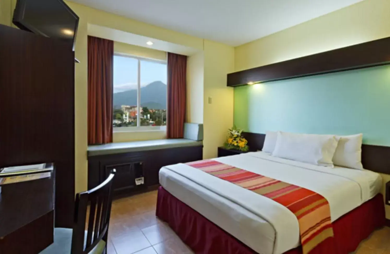 Bed in Microtel by Wyndham Batangas