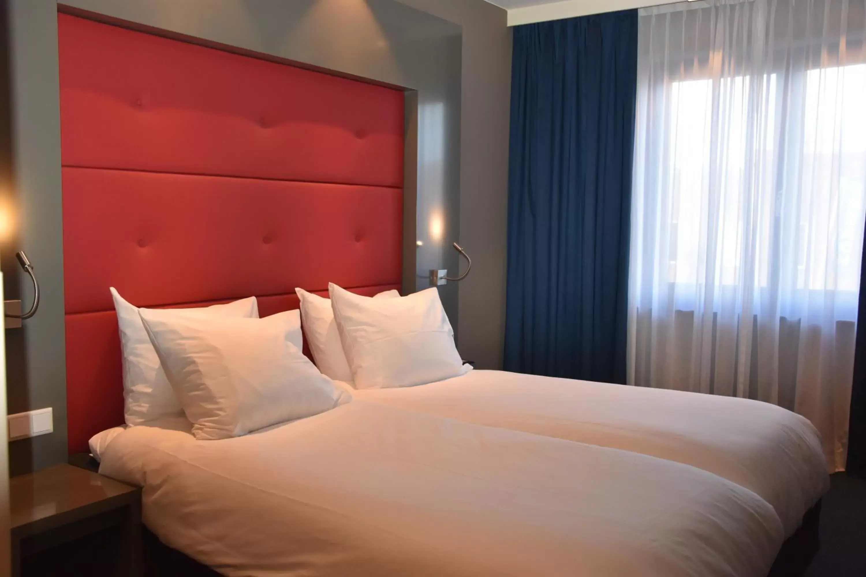Bed in Blue Mansion Hotel