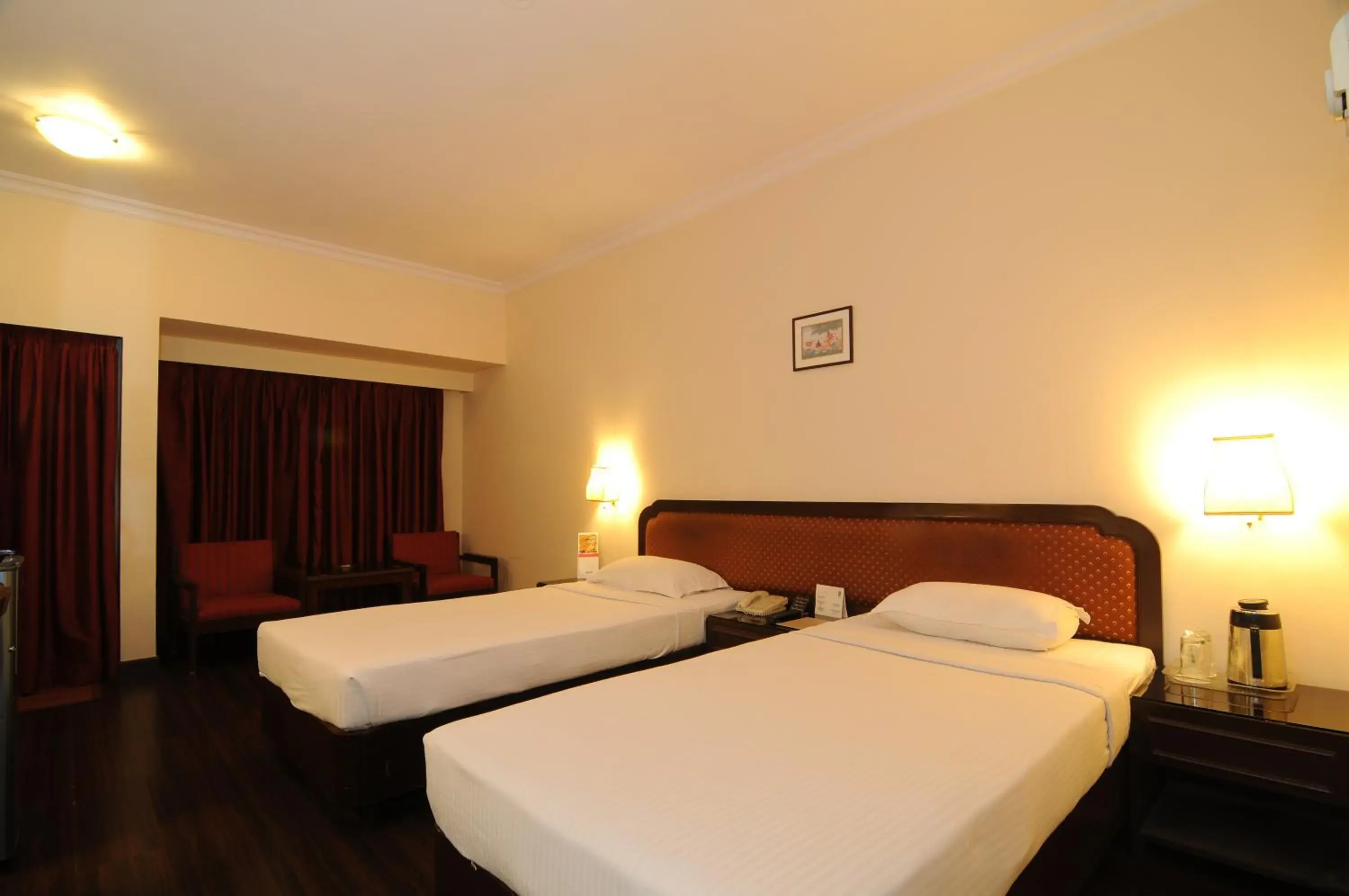 Bed in Quality Inn Regency, Nashik