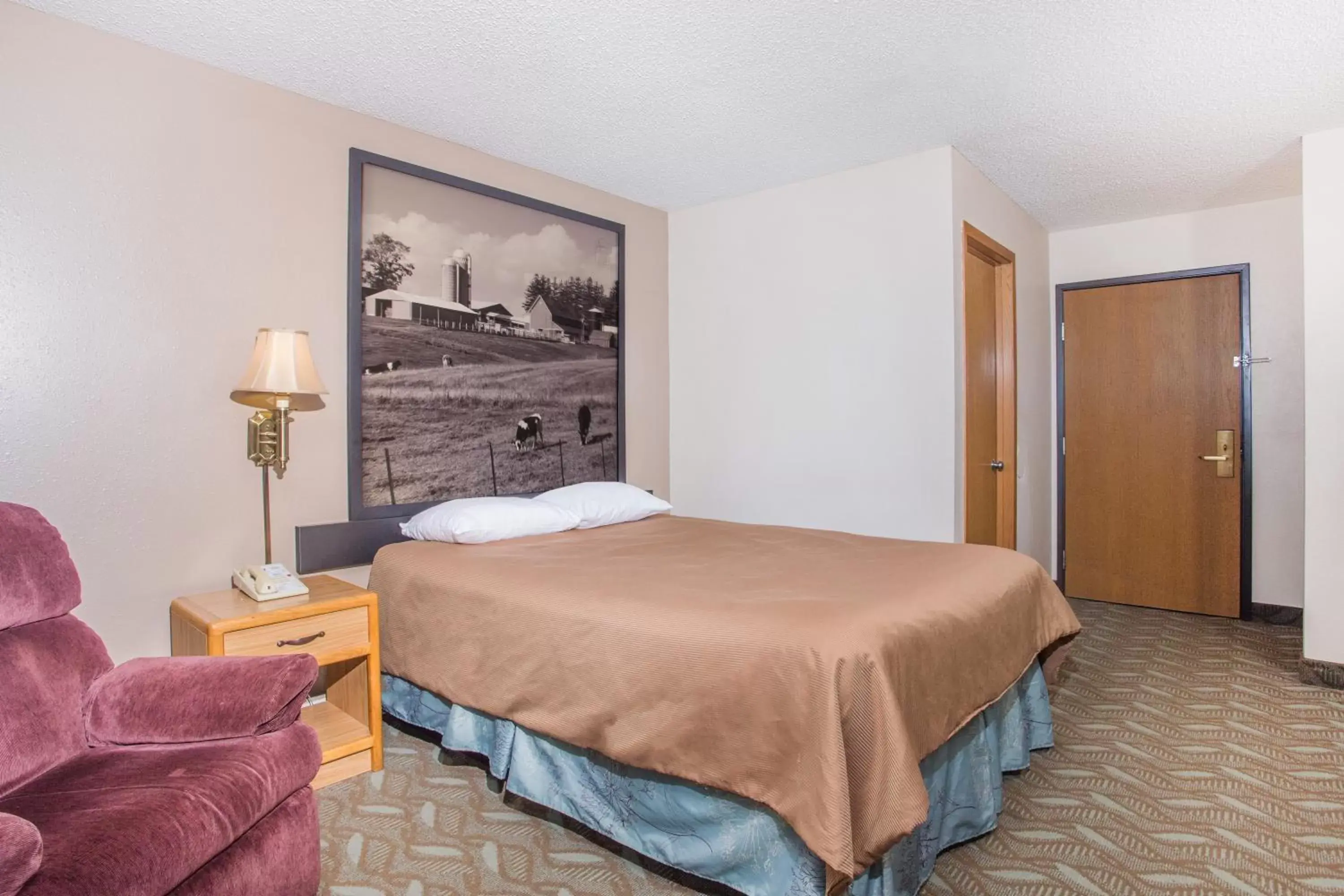 Bedroom, Bed in Super 8 by Wyndham Monroe WI Bedroom, Bed in Super 8 by Wyndham Monroe WI