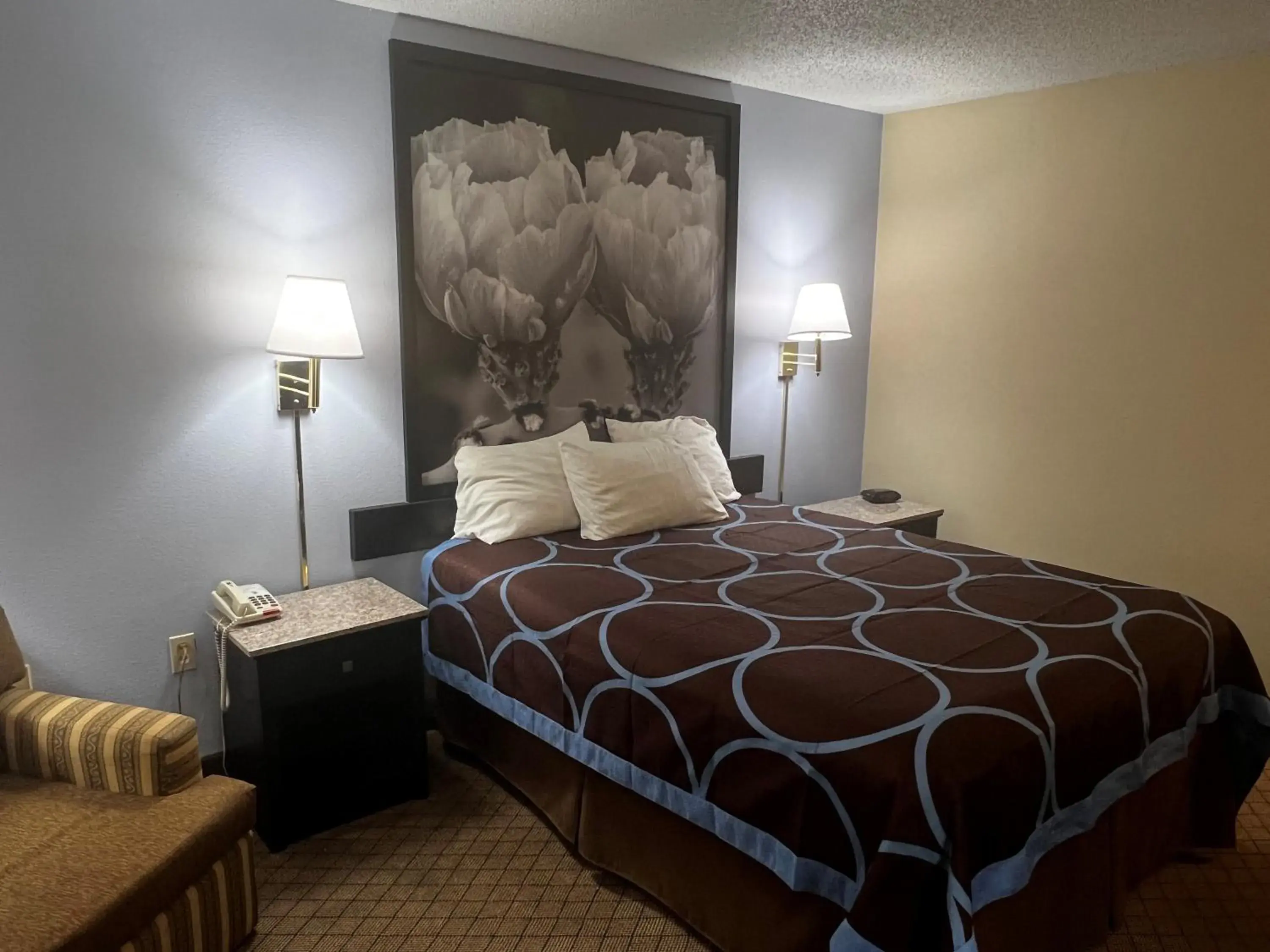 Bed in Super 8 by Wyndham Cleveland TX