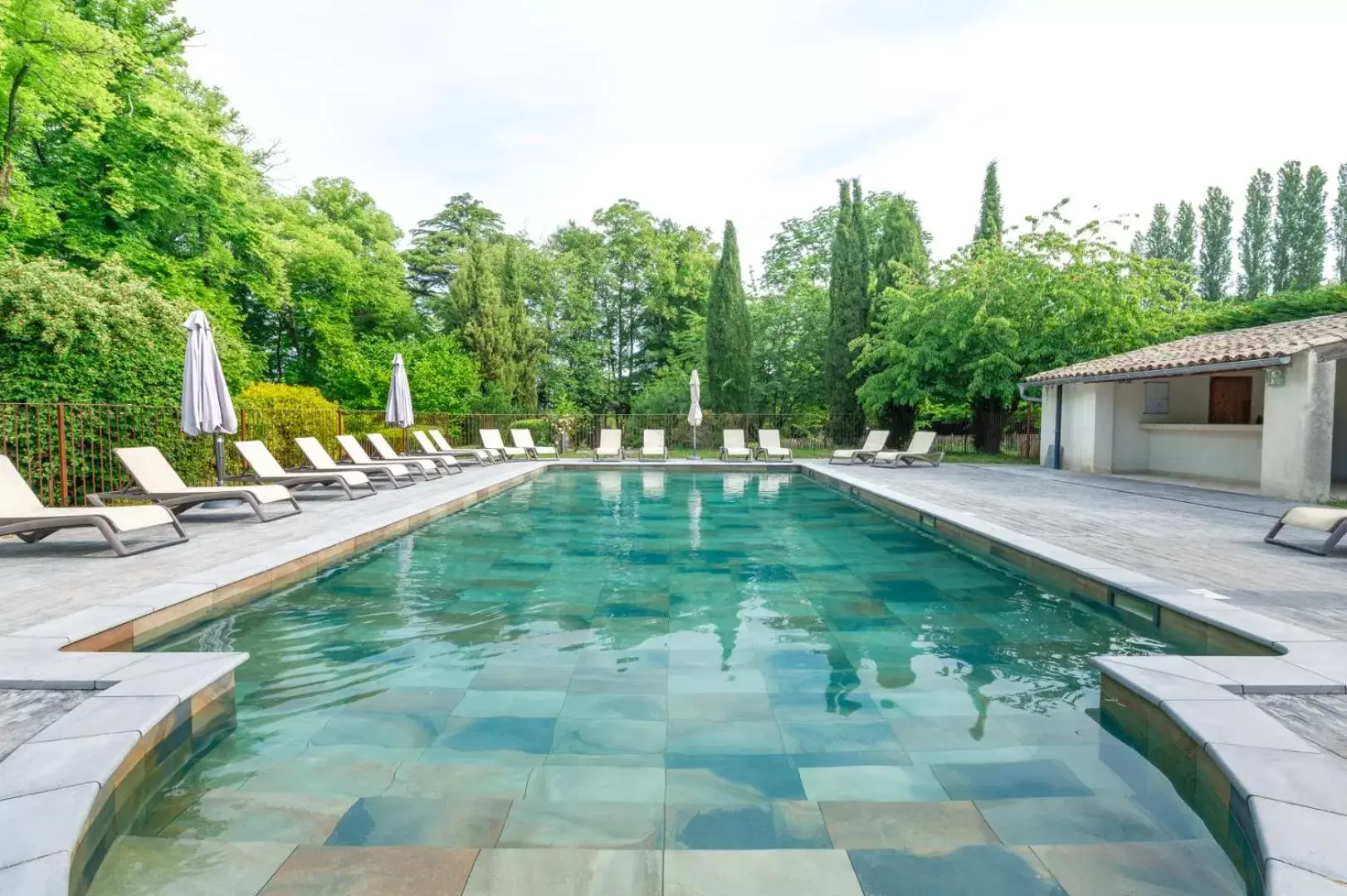 Swimming Pool in Hôtel & SPA Ventoux Provence "Domaine des Tilleuls"