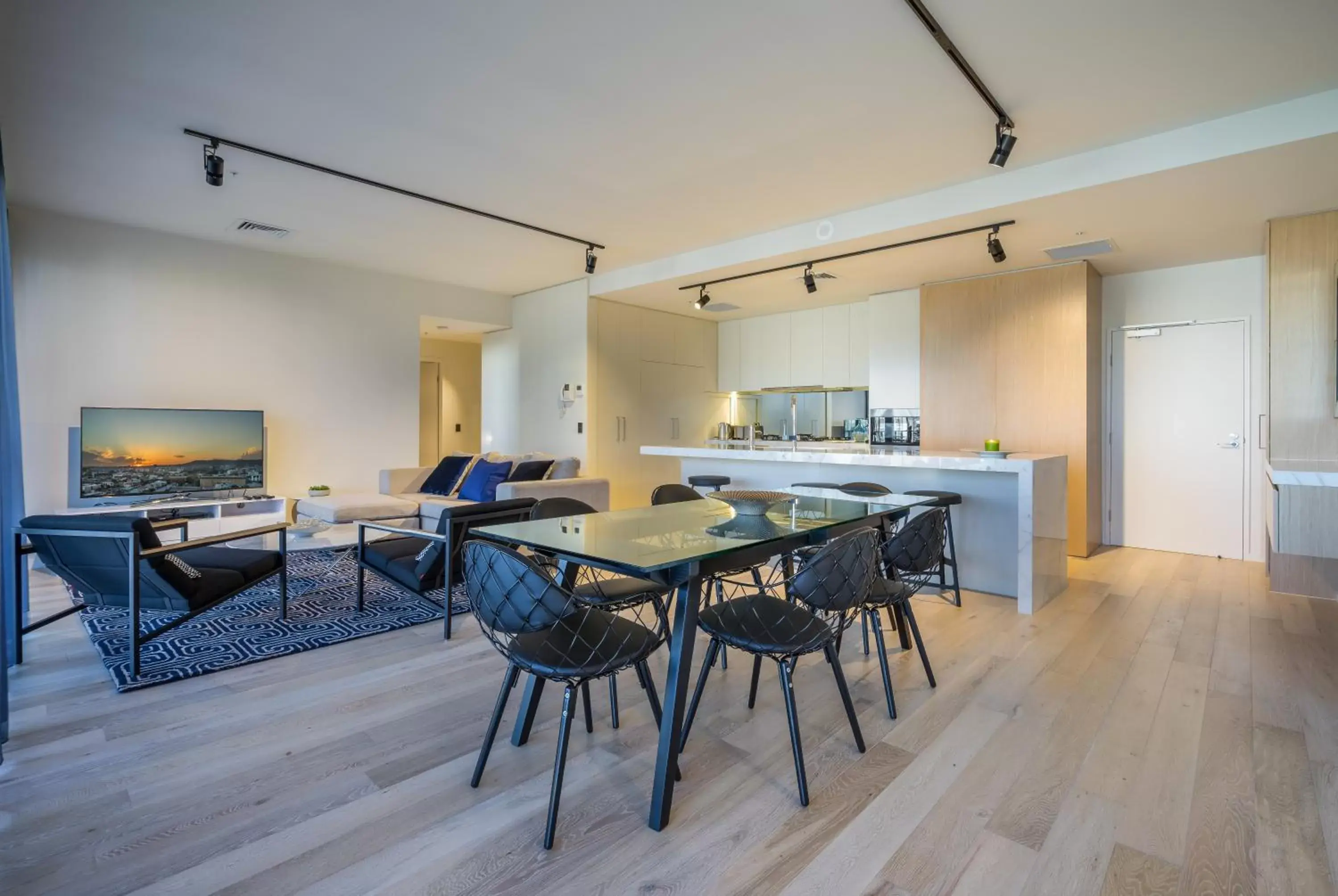 Dining area in Arena Apartments by CLLIX