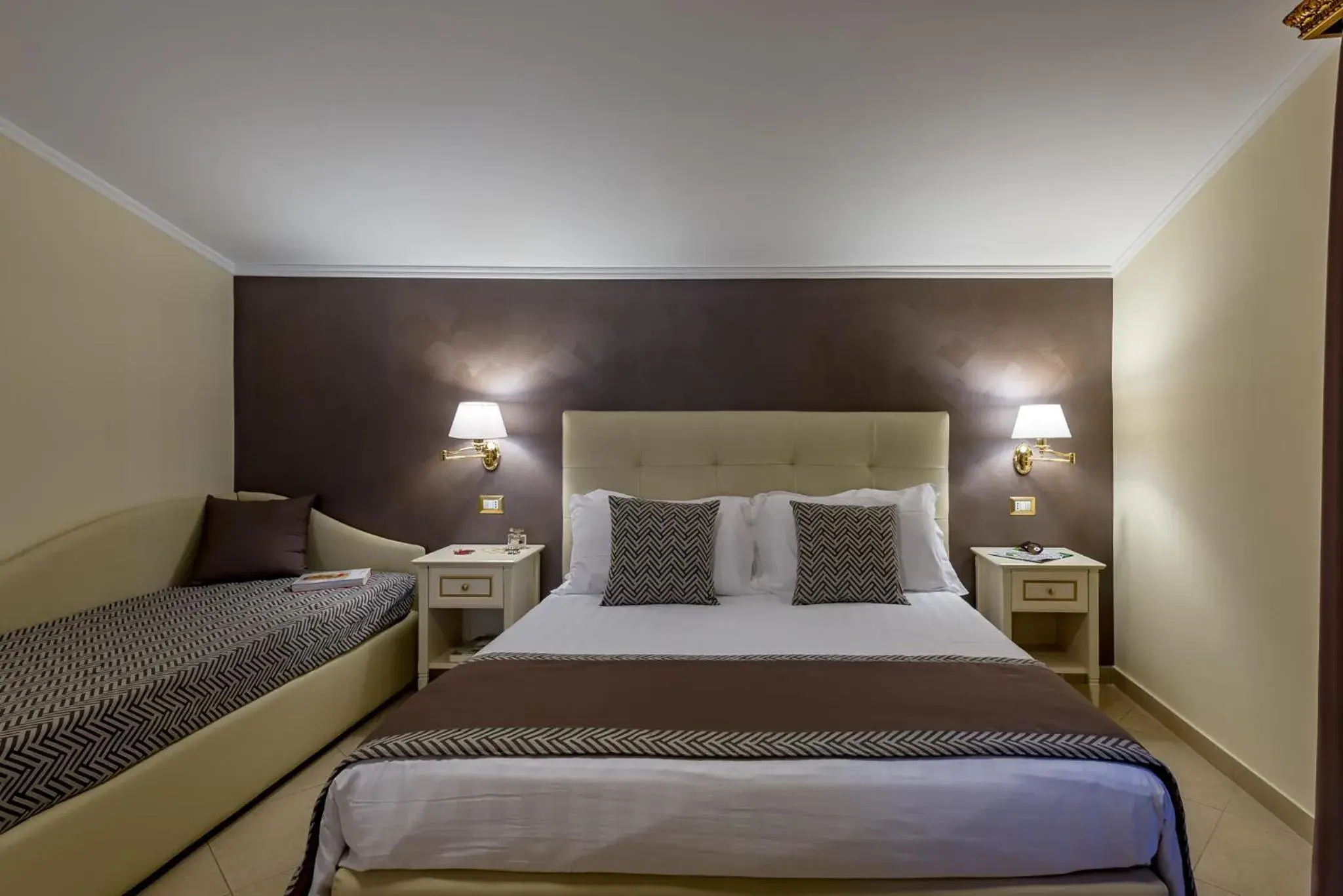 Bed in Vittorio Emanuele Boutique Hotel