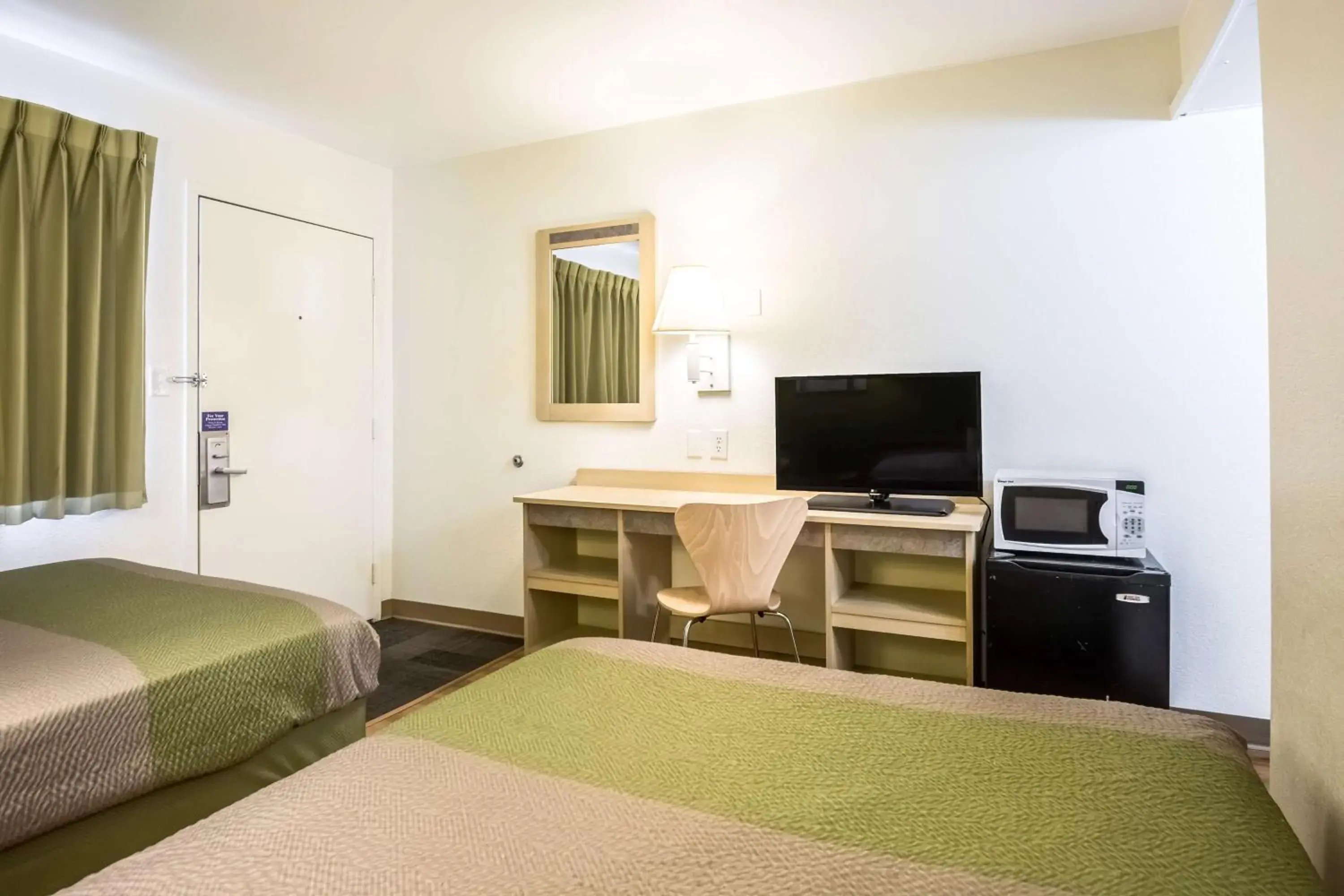 Photo of the whole room, TV/Entertainment Center in Motel 6-Pueblo, CO - I-25