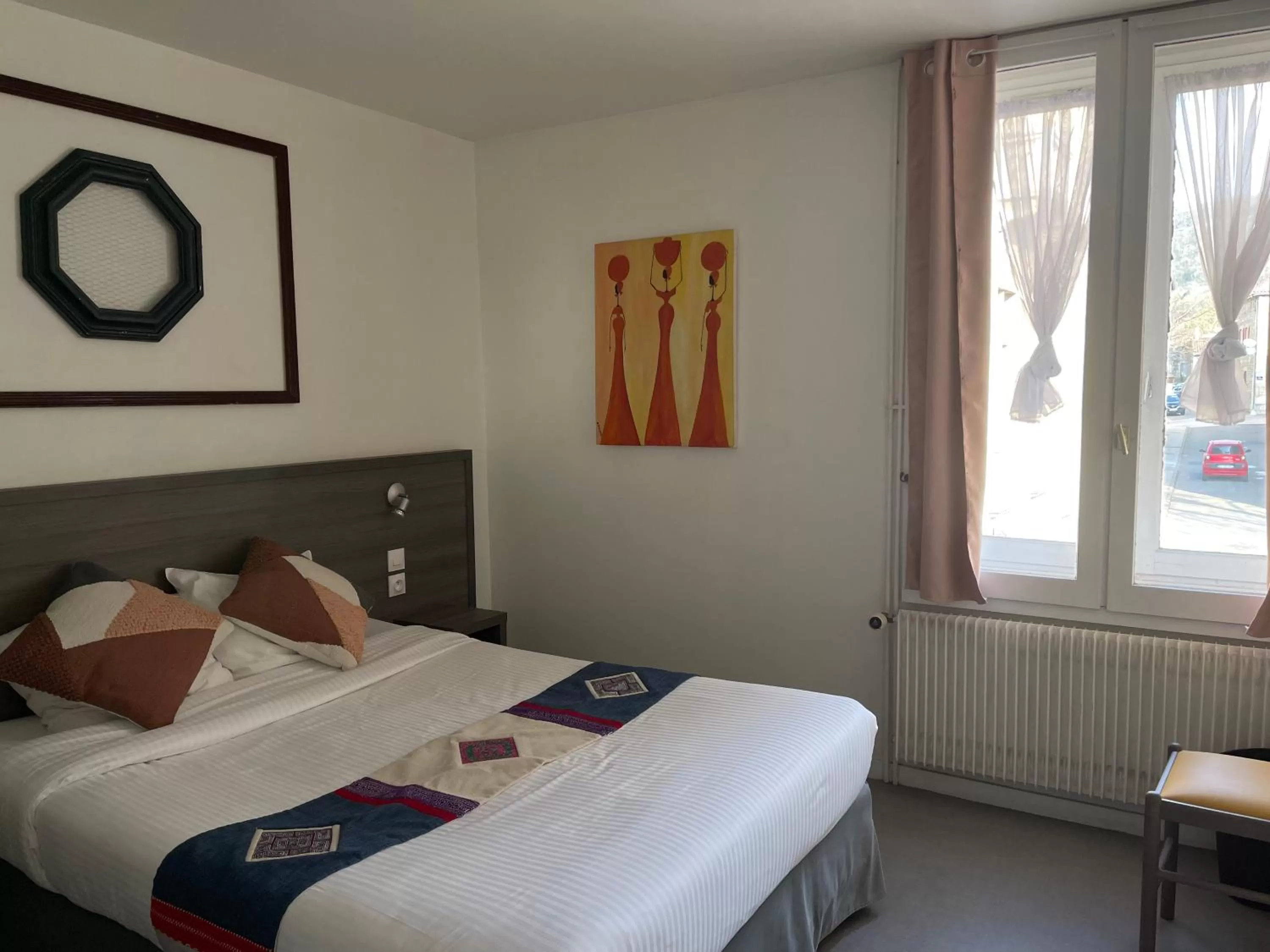 Bed in Logis Hôtel Vuillot