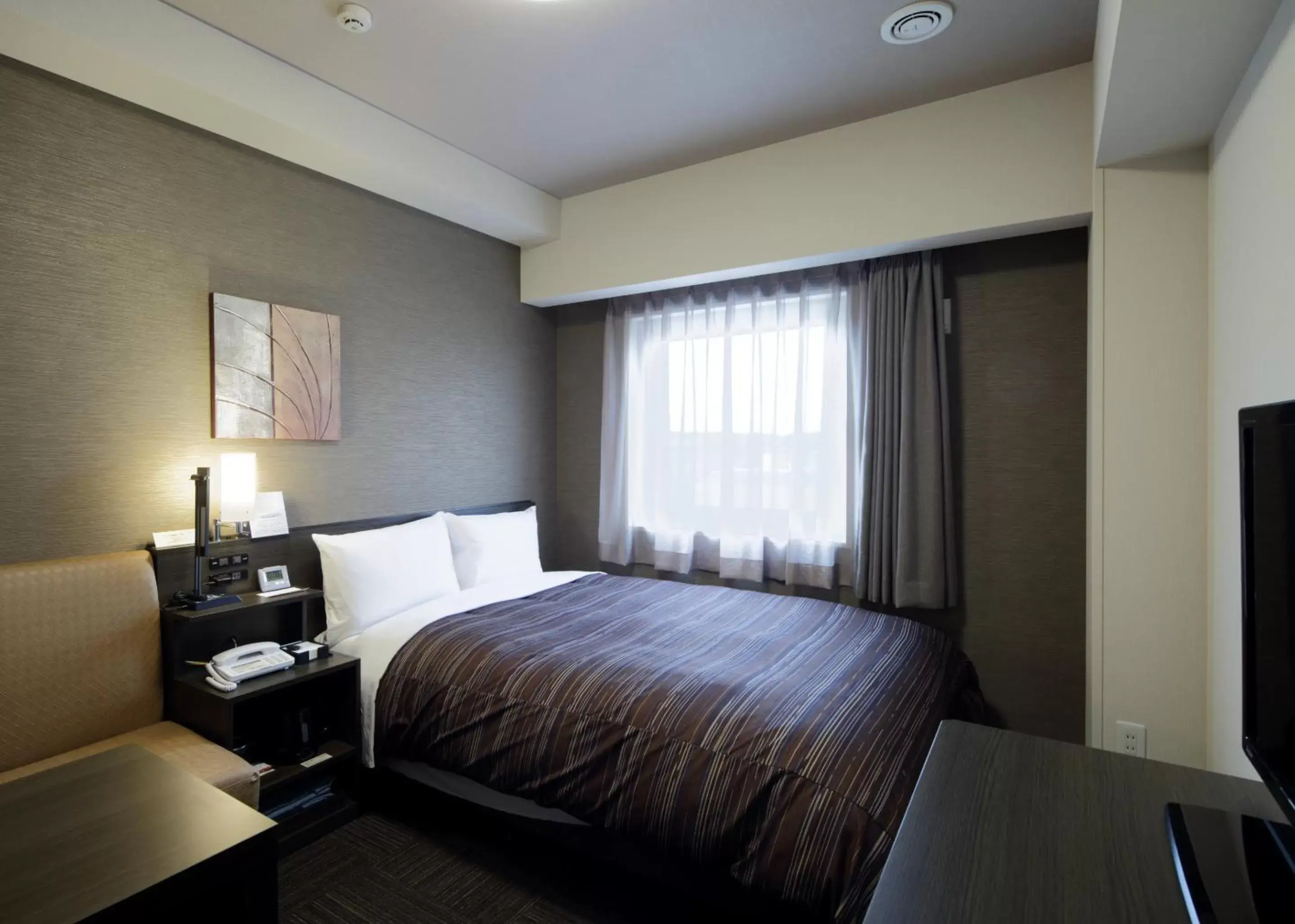 Bed in Hotel Route-Inn Kurashiki Mizushima