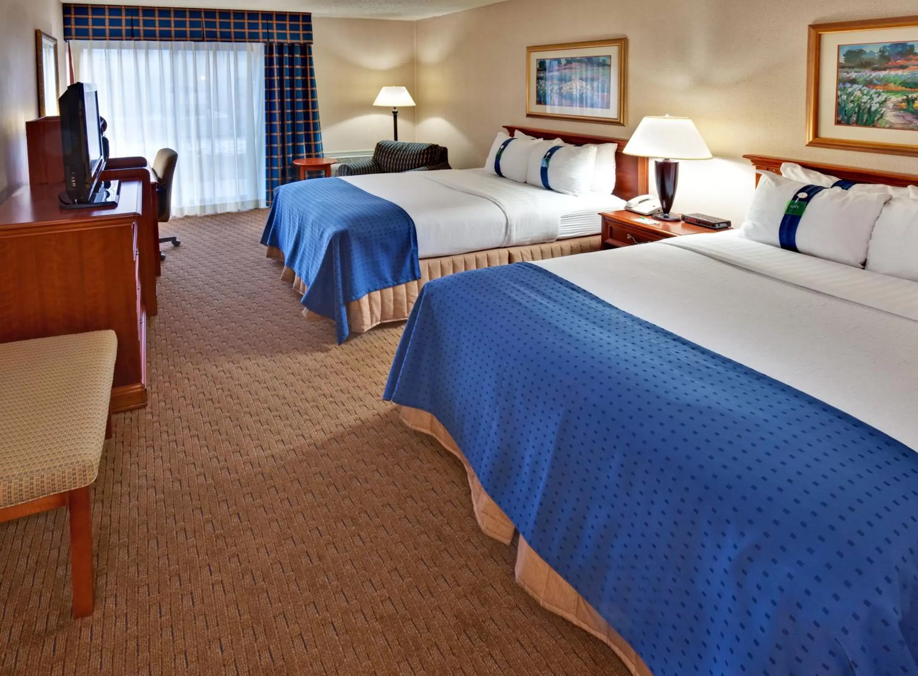 Photo of the whole room, Bed in Ramada by Wyndham Midtown Grand Island